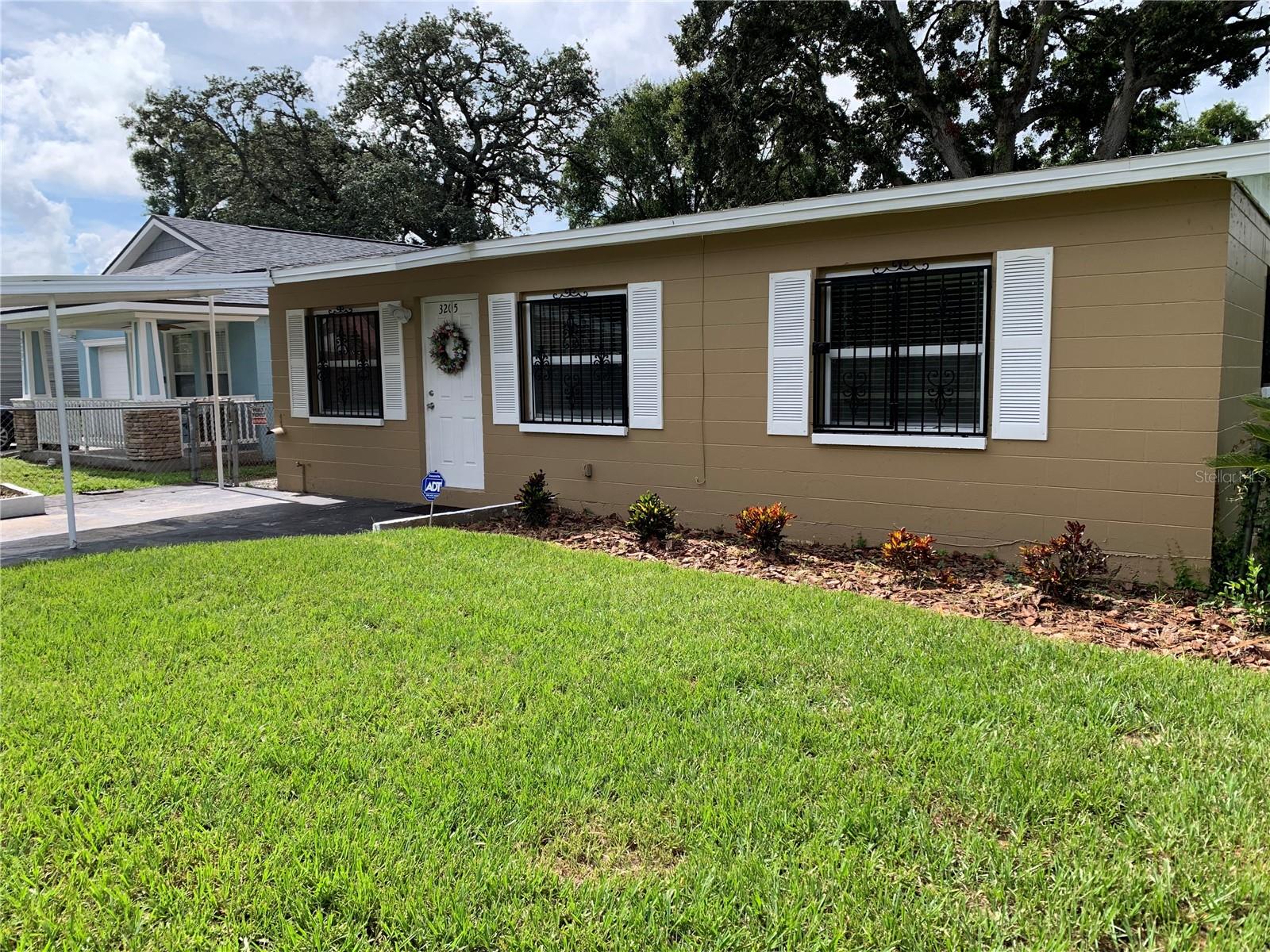 Welcome to this charming 4 bedroom, 2 bath home in the heart of Tampa. It is centrally located and is close to downtown, YBOR city, Busch Gardens and minutes from I-4 and I-275. It has lots of charm and beauty. Inside, you'll find a spacious layout. The interior has new flooring in all of the bedrooms and formal areas. The roof is less than two years old. The rear yard is fully fenced and has a storage shed. The carport offers convenient off-street parking. This is a mature neighborhood, NO HOA and NO CDD. Don't miss your chance to own this lovely home. This one may not last long. Schedule a showing today.