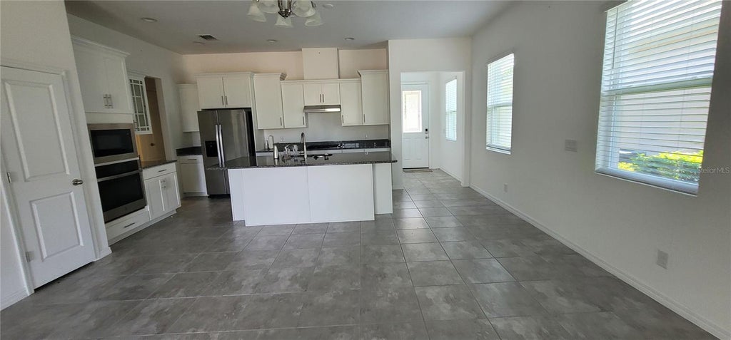 Photo of 1908 Flora Pass Place, Kissimmee, FL 34747 (MLS # O6437912)
