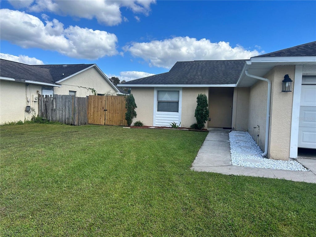 Photo of 33 S Palm Avenue, Kissimmee, FL 34741 (MLS # S5160242)