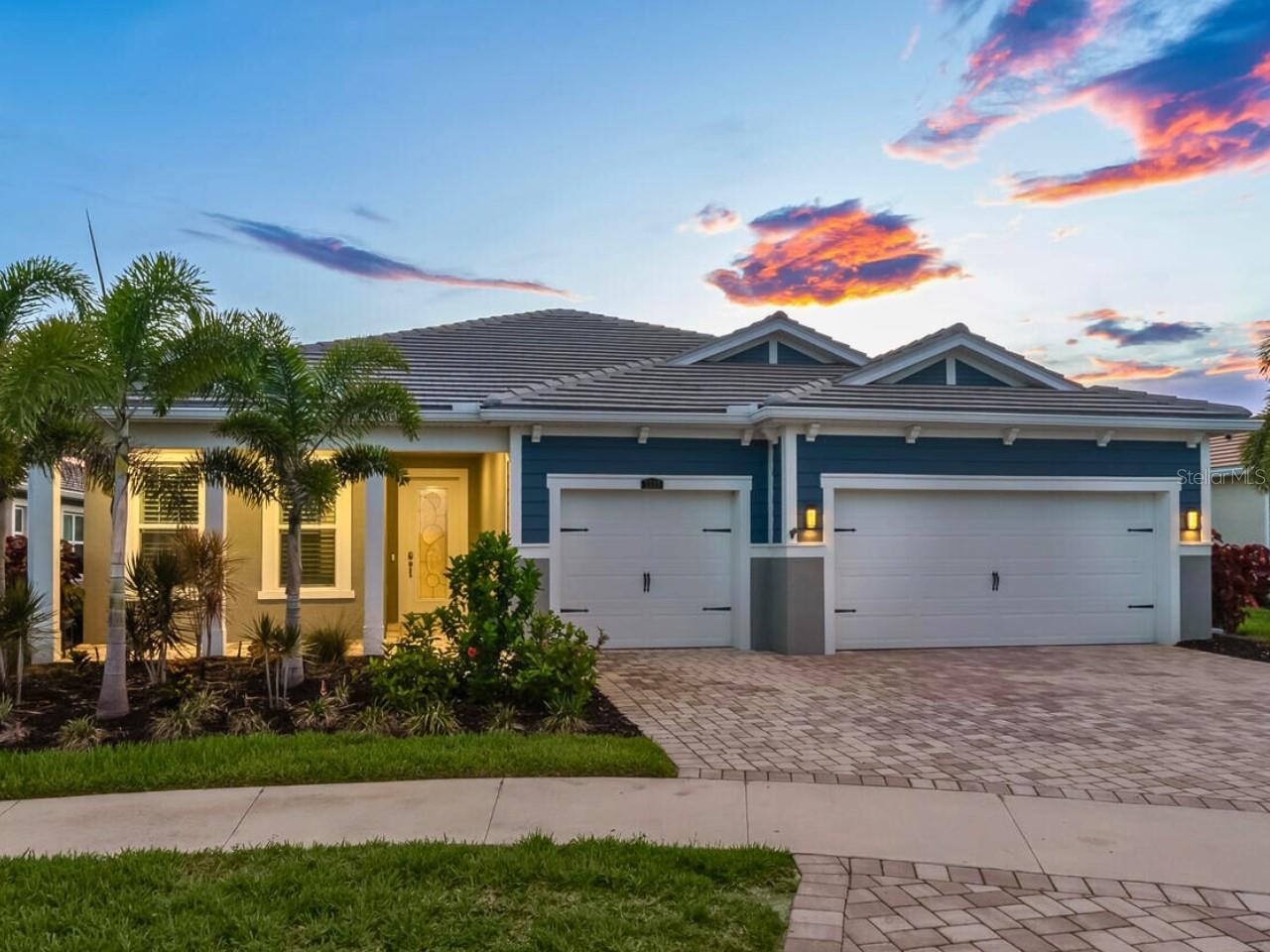 You've found it: the only single-story Sarasota home over 2,500 sq ft under $1.5M with a pool built 2019 or newer, west of I-75. Every high-end detail meticulously completed in this gated Sunrise Preserve gem, offering immediate luxury and saving you hundreds of thousands in upgrade decisions and time. From a 2023 roof to a spacious enclosed pool deck with a built-in gas outdoor kitchen, hurricane-impact windows and sliders, whole-house generator and security system, this three-bedroom home also has a dedicated office beside the pool.
Interior Highlights: Open-concept floor plan with porcelain tiles, soaking tub, massive primary walk-in closet, a chef's kitchen with an upgraded LG refrigerator, new KitchenAid double oven, eat-in island with sink, walk-in pantry, exhaust fan, plus a dedicated laundry room with sink and built-ins. Primary Bedroom Wing: freestanding soaking tub, upgraded dual vanities with LED lighted mirror, glass-enclosed shower with bench, spacious walk-in closet and a custom shoe rack. For Visitors + Family: Guest-friendly split-floor plan provides ultimate privacy, where two full guest bathrooms are equipped with LED lighted mirrors and glass-enclosed showers. The Star Feature? The west-facing pool area overlooks a tranquil lake, allowing Sarasota sunset views that will fill your phone's storage! Stroll from the great room through hurricane-impact sliding glass doors into your enclosed outdoor oasis, with a covered outdoor kitchen, waterfall, hot tub, and large pool, designed for year-round entertaining in multiple spaces. Ensuring a bug-free environment, play board games or dine under two fans behind the motorized sun shades, and drop the privacy screens for effortless comfort and seclusion. Pour guests pristine water with a whole-house reverse osmosis system. While you have your own pool at home, this prime location puts you across the street from the amenity-rich clubhouse with a resort-style pool, tennis courts, dedicated pickleball courts, firepit, fitness center, and more. Outside the gates, a new Publix will be just 1.5 miles away and there’s easy access to I-75. Downtown Sarasota's vibrant arts, dining, and entertainment are a quick drive, and the top-rated beach in the U.S., Siesta Key, becomes your closest beach.