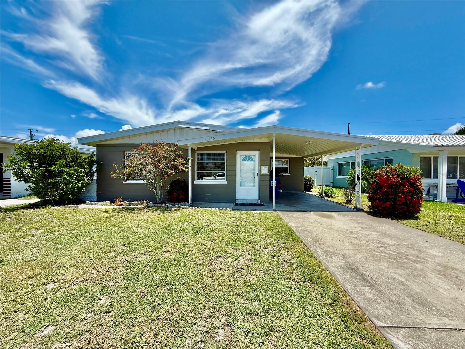 Your Slice of Florida Paradise Awaits! Welcome to your dream beach retreat in beautiful Treasure Island where modern comfort meets coastal charm! This fully updated 3-bedroom, 2-bath home is move-in ready and perfectly situated just moments from the powdery white sands of the Gulf of Mexico. Enjoy brand new flooring, paint throughout, appliances, and high-end fixtures! The newer kitchen is a true showstopper, featuring gleaming granite countertops, stainless steel appliances, classic white shaker cabinetry, and a spacious island with breakfast bar perfect for casual meals or entertaining guests. Neutral paint inside and out creates a clean, coastal vibe throughout. The two luxurious new bathrooms showcase stylish tile work and a stunning walk-in shower, adding to the homes upscale feel. Durable luxury vinyl plank flooring flows throughout the home, offering both elegance and easy maintenance. Enjoy multiple living areas, including a cozy living/dining room and a spacious family room, ideal for gathering with friends and family. The generous primary suite features sliding glass doors that open to a large, covered patio perfect for morning coffee or evening cocktails while overlooking the stunning backyard which includes astro turf. Additional highlights include an interior laundry room conveniently located off the kitchen, a large driveway, and a covered carport offering plenty of parking. Located in a highly walkable neighborhood, you're just steps from local parks, restaurants, shops, and, of course, the stunning beaches of Treasure Island. Only 20 minutes to St. Pete Clearwater Airport and an easy drive to Tampa International, downtown St. Pete, Raymond James Stadium, and more this is truly Florida living at its best. Don't miss your chance to own a piece of paradise! In addition to the advertised base rent, all residents are enrolled in the Resident Benefits Package (RBP) for $50.00/month which includes HVAC air filter delivery, credit building to help boost your credit score with timely rent payments, utility concierge service making utility connection a breeze during your move-in, and much more! More details upon application. Pets welcome, 2 max, 50 lbs. Vacant and Available Now!