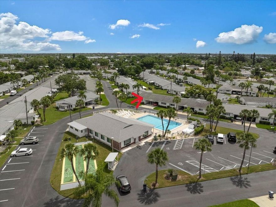 One or more photo(s) has been virtually staged. All Block Construction | Hurricane Windows & Doors | New Flooring Throughout!

Welcome to 2222 Orange Blossom Lane—an exceptional 55+ residence offering durability, style, and true peace of mind. This beautifully updated home features hurricane-impact windows and doors, new flooring throughout, a new water heater. Inside, you’ll love the open floor plan enhanced by crown molding, and a beautifully updated kitchen that has been opened to the rest of the living area, complete with stainless appliances, WASHER /DRYER HOOKUP, creating a bright, seamless space with a very coastal flair. The home is partially furnished for added convenience.

Additional highlights include a covered carport and a tastefully updated bathroom with a ceramic tile surround in the shower, making this property truly move-in ready.

Enjoy resort-style living in this active 55+ community with a pool, clubhouse, and shuffleboard, all just steps away. The condo fee covers the clubhouse, pool, exterior landscaping, roof, exterior maintenance, as well as internet, cable, making for truly easy, low-maintenance living. Ideally located near public transportation, restaurants, IMG Academy, and Sarasota-Bradenton International Airport, everything you need is within easy reach.

With very low taxes and an affordable HOA/condo fee, this property offers incredible value. Whether you're looking for a seasonal getaway or full-time Florida living, this coastal-inspired home is a must-see!