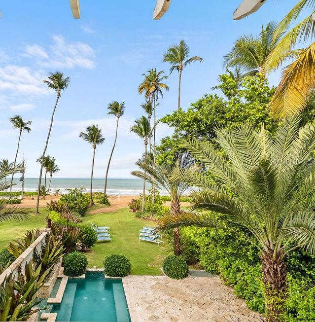 Short Sale. Welcome to the award-winning 5-diamond St. Regis Bahia Beach Resort and Golf Club. Peace and serenity await you at this beachside stunner nestled at the base of El Yunque rainforest, where you can enjoy the best of beach living, mountain views and lush rainforest flora. Scattered throughout the resort is arguably the best golf course in Puerto Rico, a Robert Trent Jones Jr. masterpiece, which according to Golf Digest is “like vacationing in a nature preserve.” With unmatched authenticity with respect to its flawless integration into the landscape at the base of the Yunque rainforest, you will be lost among the many native bird species to the resort and the 2 miles of sprawling, raw South Atlantic coastline.
This beachfront townhome sits on about 3/8ths of an acre of land that leads out to your own piece of Puerto Rico beach heaven. This is the best priced beachfront residence located anywhere within the prime areas of Puerto Rico, and is just a few steps from the St. Regis beach club, but does not abut it, providing you with the perfect blend of privacy and convenience. Four luxurious bedrooms make this a prime property for a large and growing family, or you may also take advantage of the white-hot short term rental opportunity that comes with a beachfront residence within one of the Caribbean's finest resorts. Perfectly appointed, delivered turn-key, and uniquely private, this is your opportunity to live your Puerto Rico dream.