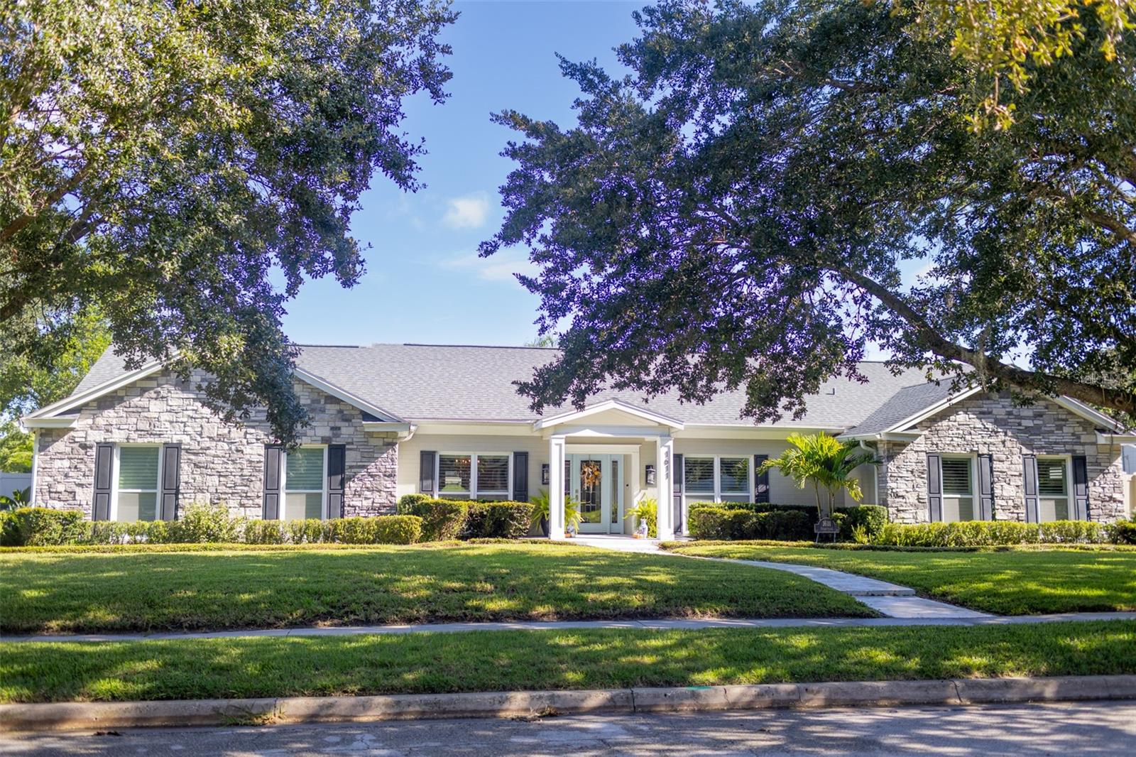 Quiet one story corner lot Charles Clayton pool home on tree lined cul de sac street in Winter Park Hills. Fully updated four bedroom two bath with ceramic tile floors and neutral colors throughout. Spacious open concept floorplan all on one level. New roof 2020