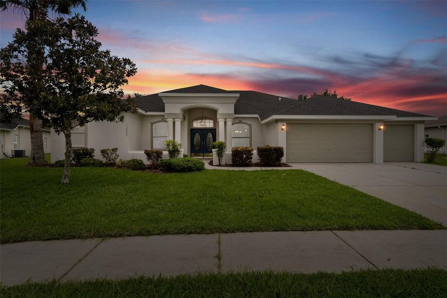 Nestled within the sought-after, gated community of Pristine Place, this stunning residence offers the perfect blend of elegance, comfort, and functionality. Featuring 4 spacious bedrooms (including two master suites), 3 full bathrooms, and a 3-car garage, this home was thoughtfully designed for modern living—and is fully wheelchair accessible for ultimate convenience. Major updates completed in 2022 include a new roof, A/C system, hot water heater, and pool equipment—ensuring long-term comfort and efficiency. Step inside and be immediately captivated by the panoramic pool views framed by 8-foot sliding glass doors. Every corner of this home reflects refined craftsmanship—luxury vinyl plank flooring, oversized baseboards, arched entryways, and tray ceilings create a timeless, elegant atmosphere.The chef-inspired kitchen is a true centerpiece, beautifully remodeled with white solid-wood cabinetry, granite countertops, tile backsplash, and a spacious island with breakfast bar. Stainless steel appliances and a new home warranty offer peace of mind, while the open layout seamlessly connects to the family room—complete with a custom fireplace mantle and more views of the sparkling pool.The primary master suite provides a serene retreat with private lanai access, vaulted ceilings, and dual closets, including a generous walk-in. Its spa-style ensuite features a garden tub, separate shower, and modern finishes. The second master suite is equally impressive, offering privacy for guests or extended family.A versatile flex room adds even more flexibility—perfect as a fifth bedroom, home office, gym, or playroom, depending on your lifestyle needs. Step outside to your private resort-style oasis—a sprawling screened lanai showcasing a sparkling pool with an integrated spa, a built-in outdoor grill, and lush landscaping that creates a tranquil escape for entertaining or unwinding. Welcome home to Pristine Place—where comfort, elegance, and accessibility come together beautifully.