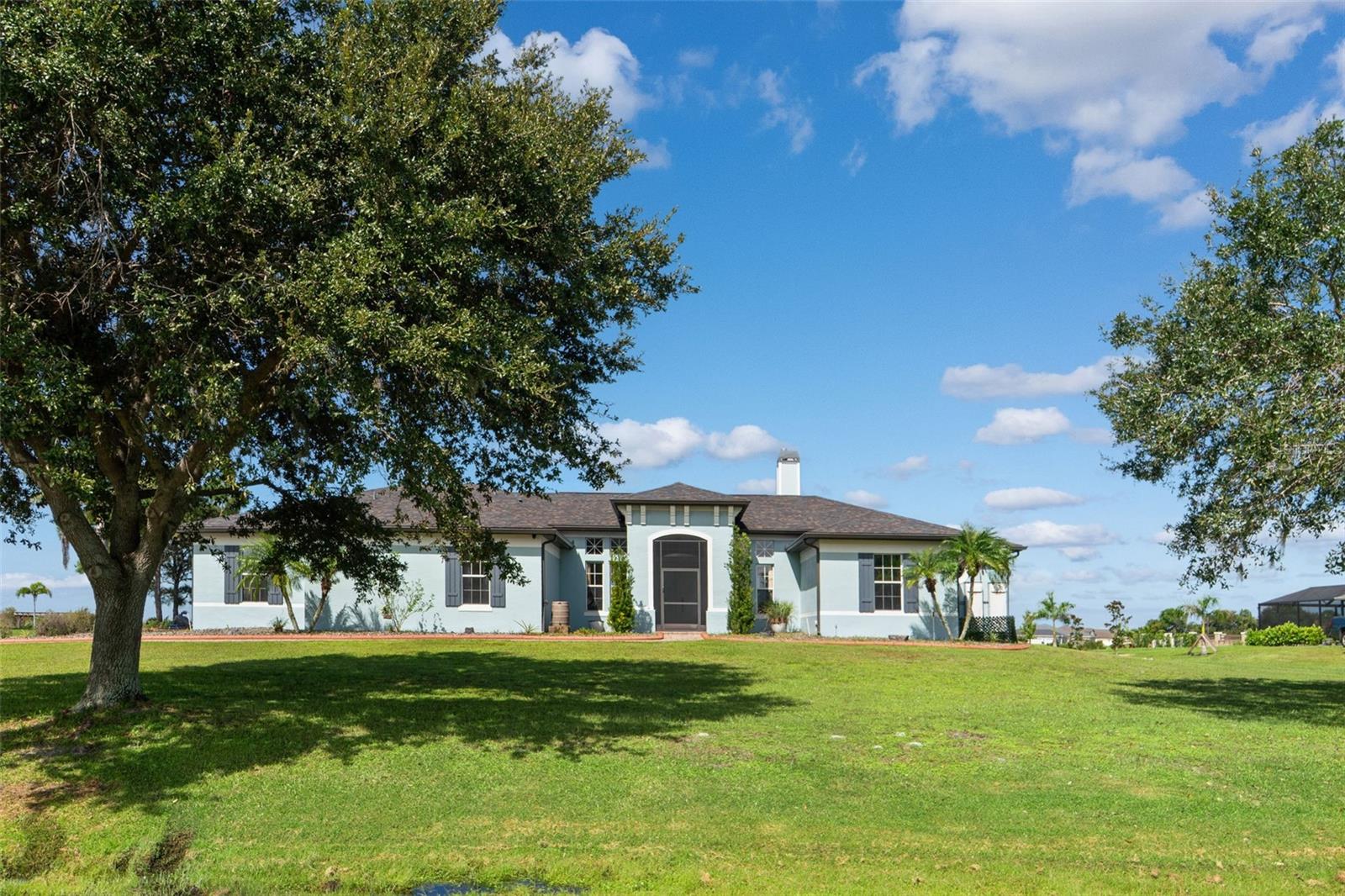 Why wait months for new construction?
This fully upgraded, move-in-ready waterfront estate offers luxury, energy independence, and instant equity — priced below market value for a
quick sale! Located in the private, gated community of Lake Toscana, this 4-bedroom, 3.5-bath + office home sits on a 1.1-acre deeded lakefront lot with mature landscaping and no waiting for build-out delays. Nearly 3,700 sq ft of heated living space plus an oversized 3-car garage deliver both function and flexibility.
Outside:
- 20’ x 40’ enclosed heated saltwater pool with travertine deck
- 900 sq ft turfed area with putting green with 4 custom holes & berms
- Wraparound patio + separate lakeside seating area
- Solar-heated outdoor shower & pool
- Exterior fully repainted in 2022
Inside:
- Open-concept layout with gas fireplace and high ceilings
- Cambria quartz kitchen counters, glass backsplash, custom cabinets
- Spacious office + formal dining + laundry with sink, washer/dryer 2018
- Stylish remote-controlled fans throughout, including garage
- Remote controlled blinds in living room and master doors
- New roof (2020) | Dual AC units (2019) | Hybrid water heater (2021) and chef kitchen appliances
Powering it all is a 26.2 kW whole-house solar system (2021) with 36 kWh battery backup and
ATS — delivering ultra-low utility bills and full off-grid capability. Battery back up. Paid off in sale of home.
Also included:
- Whole-house water filtration, softener, UV light + RO system
- Security camera system (POE + DVR), alarm system
- Garage and attic storage access, solar exterior lighting
Community lake access allows kayaking, paddle boating, and fishing in a peaceful, deed-
restricted setting with scenic trails and natural beauty.