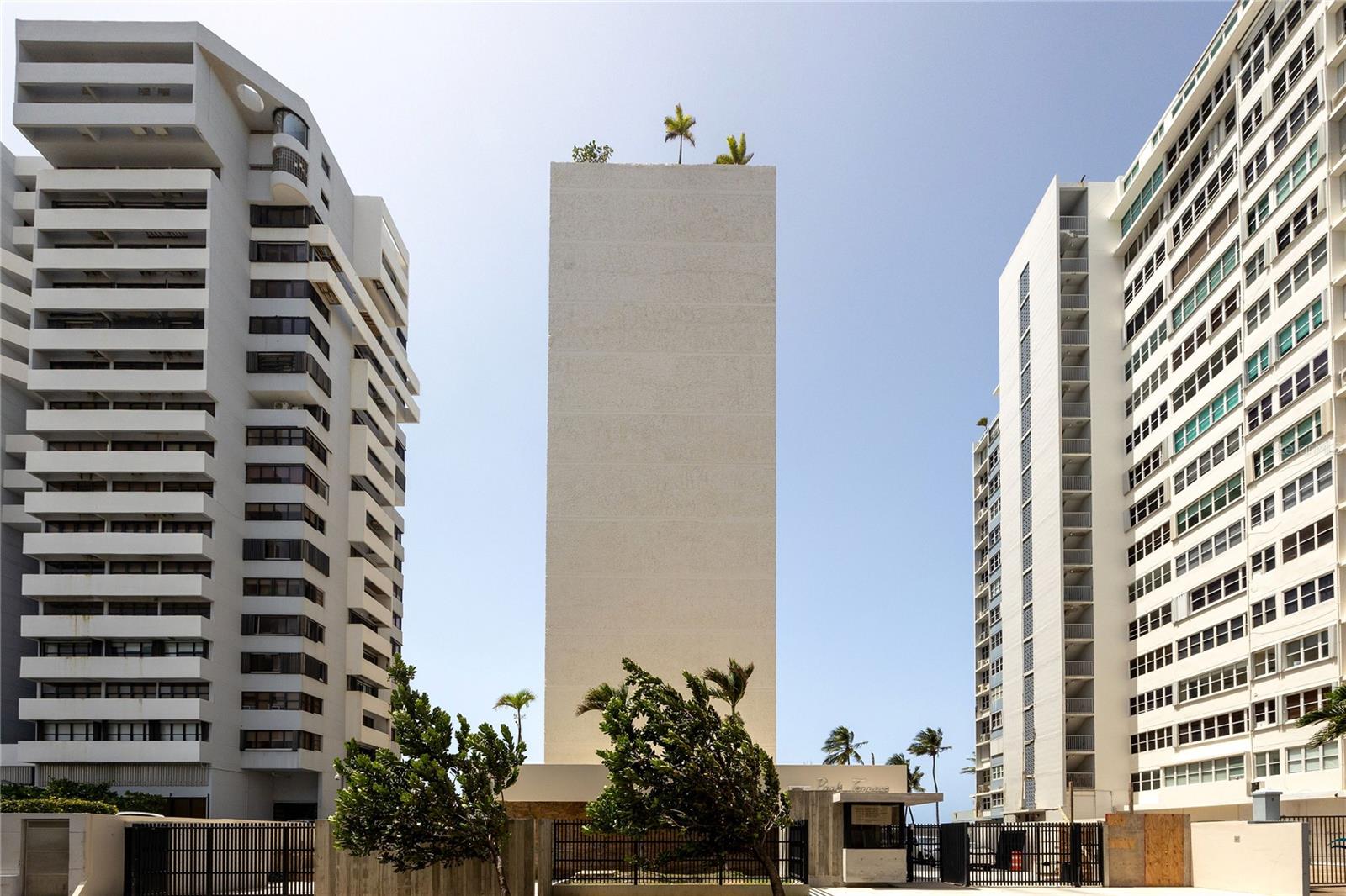 Welcome to an exceptional opportunity at Condominio Park Terrace, located in one of Condado’s most iconic beachfront buildings. This beautifully renovated 1,975-square-foot condo seamlessly blends the building’s mid-century design with modern sophistication. Originally developed by Desarrollos Metropolitanos in the 1950s, this residence offers a unique lifestyle experience on Condado Beach, in a building that has recently undergone a full update.
This oceanfront condo features three bedrooms and two and a half baths, with an expansive layout enhanced by elegant travertine flooring. Natural light floods the open-floor concept through hurricane-rated windows by Condado Windows, showcasing stunning ocean and city views. The living and dining areas transition smoothly into a chef-inspired kitchen, ideal for both intimate gatherings and grand entertaining. The kitchen boasts premium Frigidaire appliances, including a double oven and a built-in wine refrigerator, all complemented by a granite-topped island and meticulously crafted cabinetry.
The primary suite offers a serene retreat with a cedar-lined walk-in closet and a luxurious en-suite bath. Experience spa-like tranquility with a rain shower and refined finishes. Additional features include the convenience of a service elevator. Parking is prioritized with one independent covered garage and one designated outdoor spot, alongside visitor parking—a rare luxury in this area.
This distinguished building comprises just 22 condos across 11 floors, ensuring privacy and tranquility. Its beachfront location, near Parque del Indio and top schools, positions it within walking distance of fine dining, upscale boutiques, and top-rated hotels. Offering direct beach access, this residence is a rare opportunity to own a piece of Condado’s architectural heritage.
Experience the ultimate convenience in one of Puerto Rico’s most vibrant neighborhoods. This listing is an opportunity to embrace the best of Condado Beach living.