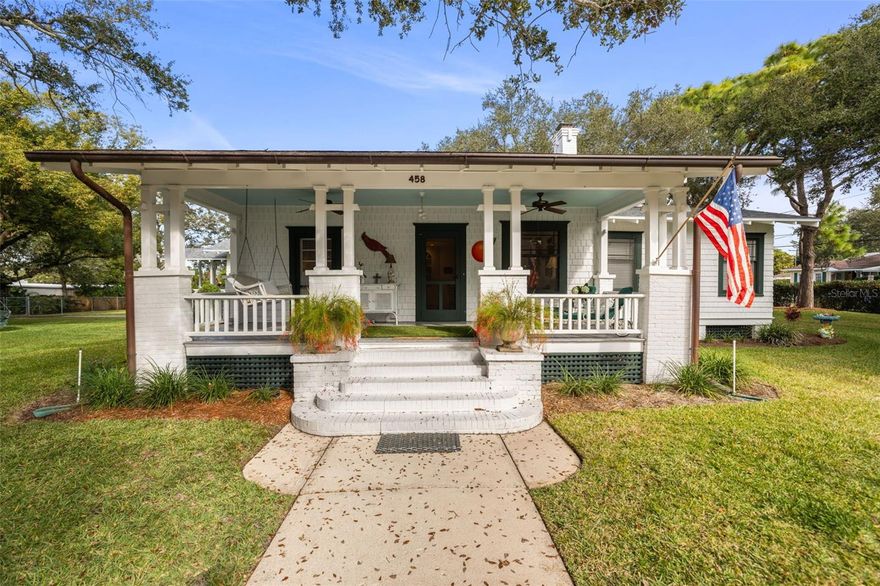 Step back in time and experience the rare magic of this circa-1915 historic Downtown Dunedin home, where craftsmanship, character, and an irreplaceable location come together on an extraordinarily large parcel just steps from the heart of the city. From the moment you arrive, the inviting front porch, framed by a wooden picket fence and accented by an exterior natural gas lantern, sets the tone for a home filled with warmth, nostalgia, and timeless appeal.

Inside, this early-20th-century residence features spacious rooms with soaring 10-foot ceilings, beautiful heart pine flooring, elegant crown molding, and a wood-burning fireplace that anchors the living space and evokes a bygone era when homes were built with intention. The dining room showcases Built-In-China cabinetry, blending period charm with everyday functionality. Abundant natural light enhances the scale and grace of rooms designed to be lived in, gathered in, and remembered.

Modern updates complement the historic character, including architectural roof shingles replaced in August 2020, two separate package A/C units (newest unit replaced July 2022) both with transferable service agreements, solar roof vents, and copper gutters that add both beauty and longevity. The property is also elevated approximately 24 feet above sea level, per USGS records.

Set on an approximately 0.60-acre lot, this property offers a sense of space and privacy that is almost unheard of in Downtown Dunedin — all while being moments from Main Street’s restaurants, breweries, boutique shopping, waterfront parks, marina, and year-round festivals.

Zoned Downtown Core (DC), this property offers exceptional flexibility beyond its current residential use. DC zoning allows for high-density residential development of up to approximately 18 units (buyer to verify), as well as commercial and mixed-use options including coffee shop, restaurant, boutique retail, or professional office. The property is also zoned to allow short-term rentals, making a boutique short-term rental or hospitality-style use a permitted option. Whether preserved as a cherished historic residence, repositioned as an income-producing asset, or redeveloped in the future, this is a truly special opportunity in one of Pinellas County’s most sought-after downtowns. Property is being sold AS-IS, schedule your showing today!