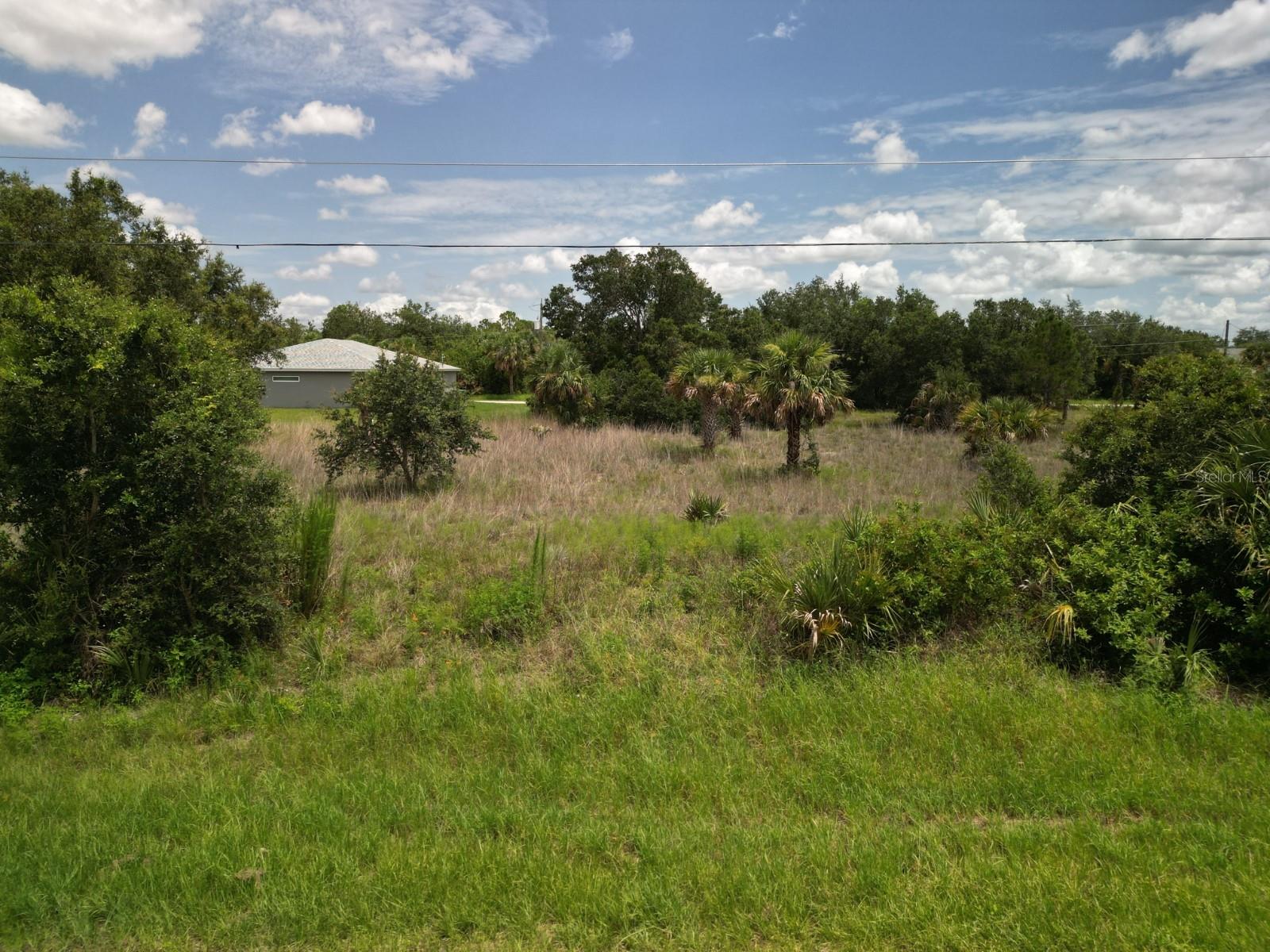 Welcome to 19194 Woodbine Ave – a fantastic vacant lot opportunity in the heart of Port Charlotte! This PARTIALLY CLEARD and FLAT LOT offers an easy build site with excellent access via paved roads and utilities nearby. Whether you're planning to build now or hold for future investment, this property is primed for potential. Located in a peaceful residential neighborhood just minutes from shopping, dining, parks, golf courses, and boat ramps, you’ll enjoy the convenience of nearby amenities while maintaining a quiet, suburban feel. Don’t miss your chance to secure a spot in one of Southwest Florida’s most sought-after growing communities!