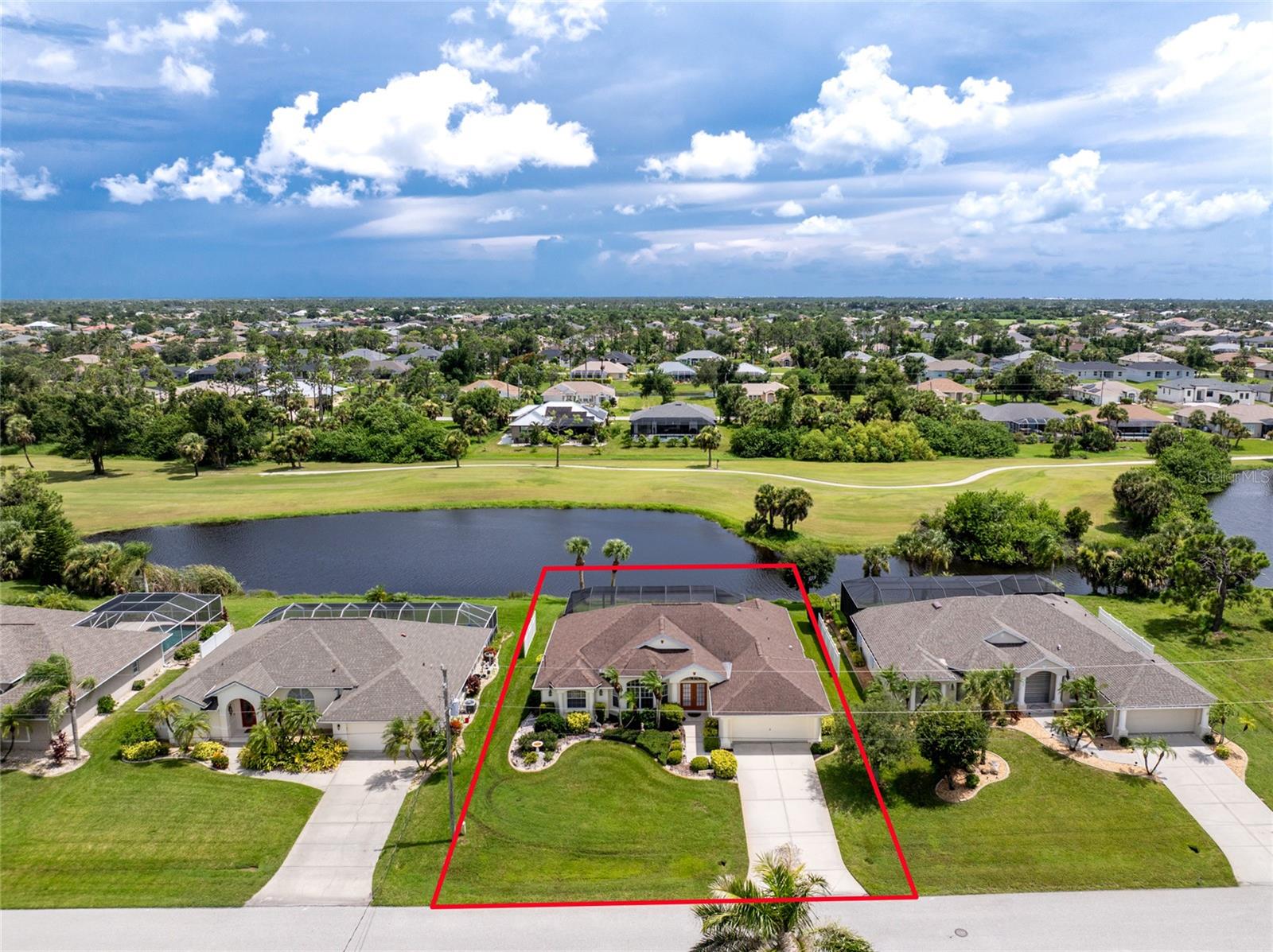 The Florida Lifestyle You Have Dreamed About Awaits in Rotonda West! This beautiful lakefront Halvorson built three bedroom, two bath pool home is being sold turnkey furnished and has a 2018 multidimensional roof, mature tropical landscaping, decorative exterior columns, and double lead glass doors with a transom window to create a warm and inviting entryway.The home is situated in an X flood zone, which may mean no flood insurance is required. Step inside to find a gorgeous chandelier in the tiled entryway accented with architecturally designed columns along with plenty of natural light from the vaulted ceilings and triple sliders that provide endless views of the pool and waterfront all work to create a truly luxurious living space. The large kitchen and breakfast nook features tile flooring, plenty of white cabinets, granite countertops, plant shelves, dual pantry closets, and stepped up breakfast bar. The formal dining room has a nice tray ceiling with crown molding for those extra special gatherings. The split bedroom floor plan will provide plenty of privacy for you and your guest. The ensuite primary bedroom is a true retreat with nice views of the lake, double door entry, a tray ceiling with crown molding, tile floors, lanai access through the sliding glass doors, and oversized walk-in closet. The primary bathroom features separate dual sink vanities, a tiled walk-in shower, and large soaking tub. Two additional bedrooms are equally inviting, one has access to the pool and a wall of bay windows, the other has a charming window seat. The guest bath has a great tub/shower combo providing convenience to guests and family and is easily accessible to the pool area. The laundry room has a utility sink, shelving and additional storage closet. Step outside to your own tropical paradise with a heated pool and spa, a 2022 ClearView screen enclosure, and peaceful lake views that make relaxing or entertaining easy. Other features include vaulted ceilings throughout, built-in niches, a pool closet, manabloc plumbing, and a pond-fed irrigation system. Living in Rotonda West means more than just golf—it’s a community with five premier courses, walking and biking trails, lakes and canals, and quick access to beaches, marinas, shopping, and dining. You’ll also be just minutes from Englewood Beach, Boca Grande, the Atlanta Braves spring training facility and the new Wellen Park area, and Historic Dearborn Street with its weekly seasonal Farmer’s Market and many events throughout the year. Don’t miss your chance to enjoy life at 42 Long Meadow Place, schedule your private tour today.