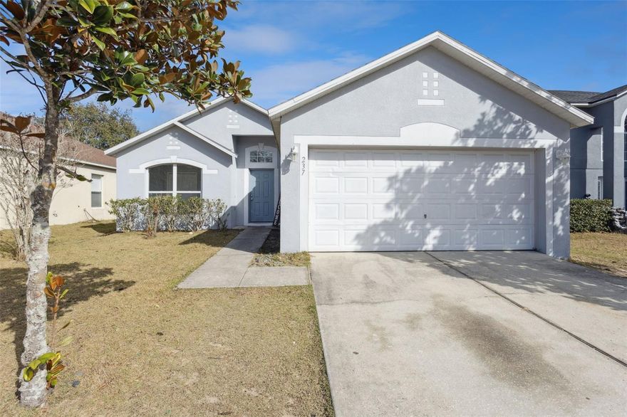 Great home located in between Downtown Groveland and Downtown Clermont. 3 bedrooms and 2 full bathrooms. Easy to clean home with no carpeting. Kitchen has updated granite counter tops with custom glass backsplash. Stainless steel appliances with newer upgraded refrigerator. Ceramic tile in kitchen and bathrooms.  Pretty wood-look flooring throughout all living areas. High ceilings in living , dining and primary bedroom gives you a nice airy and spacious feeling. The primary bath has a large soaking tub and an upgraded walk-in tile shower and walk-in closet. The 2 additional bedrooms are separated by the full bathroom with tub and shower combination. Inside laundry and attached 2 car garage. No rear neighbors.  The location is excellent with Publix, Walgreens, Dunkins, Wendys, McDonalds, KFC and Mama Rita's Italian Eatery, among other things all within 3 minutes.  Close to the South Lake bike trail and all of the events in Downtown Clermont. This home has a lot to offer at a GREAT price. Roof and water heater are both 2017. Come and view this wonderful and affordable home today.