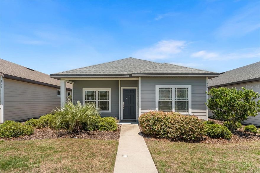 Welcome home to Lugano, a highly sought-after resort-style community beside Haile Plantation and the scenic Archer Braid Trail. Built in 2020, this beautifully maintained Lucca model offers 3 bedrooms, 2 baths, a 2-car garage, and 1,555 sq. ft. of thoughtfully upgraded living space. Enjoy a charming front porch perfect for rocking chairs before stepping into a dramatic gallery-style foyer with endless design potential—create a stylish drop zone, custom valet area, or curated gallery wall for family portraits and favorite artwork. The open floor plan offers defined spaces for a warm, private ambiance, with quiet bedroom separation and a bright kitchen, living, and dining area designed for easy everyday living. Crown molding and luxury vinyl plank flooring refine the main living spaces, while clean neutral walls are ready for the next owner’s personal touch. The kitchen features a spacious island, wood cabinetry, granite countertops, a gas range, and a French-door refrigerator. The primary suite is a private retreat with extra-insulated walls for exceptional quiet and privacy, tary with crown ceiling, luxury vinyl floors and peaceful views of serene grassy open space with no neighboring homes directly across. The spa-inspired primary bath includes Silestone quartz counters, a tiled walk-in shower, free standing soaking tub, and walk-in closet. Outside, a screened porch opens to a fully fenced private backyard sanctuary. From the garage is another corner that can be built into a drop off area. Spacious laundry room with washer/dryer conveying. Smart upgrades include SimpliSafe security, indoor and outdoor HVAC surge protection, a smart thermostat, smart Samsung dishwasher, tankless water heater, and whole-house Sentricon termite protection. Other features include crown molding, blinds and generous transom windows. The HOA adds exceptional value with front-yard landscaping, a resort-style pool and clubhouse, amenity center, dog park, basketball, tennis, and pickleball courts. The community is served by Clay Electric, valued for competitive utility rates. Conveniently located near UF, UF Health, I-75, Celebration Pointe, Butler Plaza, Haile Village, and the Archer Braid Trail. Call today!