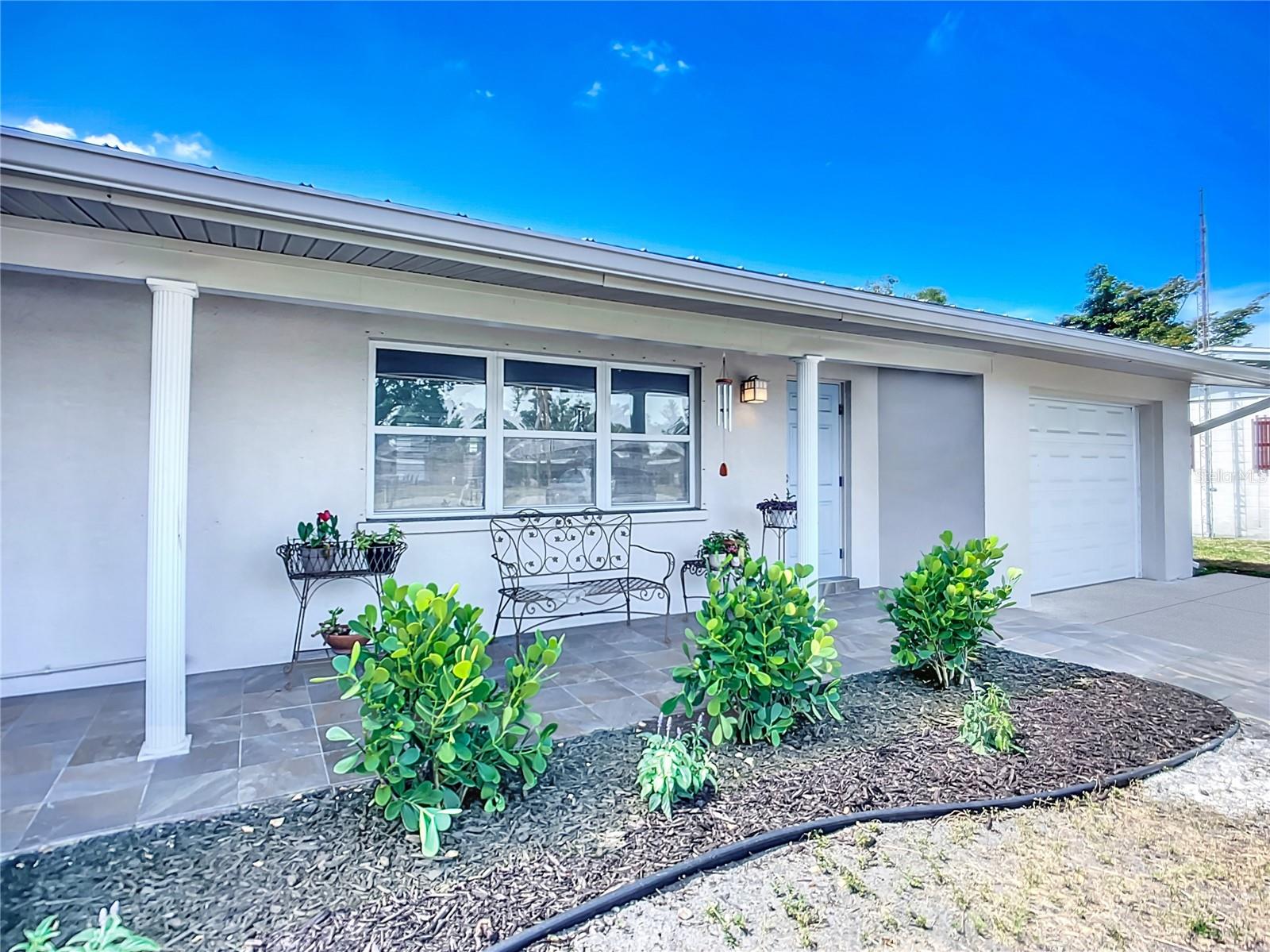 Welcome to this beautifully updated, mid-century bungalow, where vintage Florida charm meets modern convenience in the heart of Sarasota, Florida! This meticulously maintained home features stunning original terrazzo floors—recently cleaned and polished to showcase their timeless appeal. The fully renovated kitchen is a true highlight, offering crisp shaker cabinets, gleaming granite countertops, and ample storage space—perfect for the home chef or entertainer. A freshly painted interior enhances the bright, airy atmosphere throughout the home, complemented by updated lighting and thoughtful design touches. Significant upgrades provide peace of mind, including a newer metal roof, newer soffits and rain gutters, and an energy-efficient HVAC system installed in 2022. The versatile Florida room, cooled by its own mini-split AC unit, offers flexible space ideal for a home office, art studio, or personal gym. The newly updated indoor laundry room includes extra shelving and storage nooks, while the one-car garage, with an upgraded garage door (2021), provides room for tools, bikes, or lawn care equipment. Outdoor living is a breeze with an open-air patio that overlooks a spacious, fully fenced backyard—perfect for pets, entertaining, or even adding a future pool. The oversized primary bedroom (16’ x 13’) is a true retreat, featuring a renovated en-suite bathroom with a luxurious river rock tile shower, quartz countertops, and stylish new fixtures. Additional upgrades include energy-efficient replacement windows (no outdated jalousie windows here!) and a location with no HOA fees or deed restrictions, giving you complete freedom to enjoy your property your way. Ideally located in booming Sarasota, this home is just minutes from world-famous Siesta Key Beach, known for its powdery quartz sand and clear turquoise waters. Nature lovers will appreciate nearby Myakka River State Park, offering hiking, kayaking, and wildlife viewing, while cultural enthusiasts can explore The Ringling Museum of Art, Marie Selby Botanical Gardens, and Sarasota’s vibrant downtown scene. Enjoy shopping and dining on St. Armands Circle or take in the area's many festivals and community events. This is a rare opportunity to own a move-in-ready home that blends mid-century character with smart updates in one of Florida’s most desirable coastal cities. Don’t miss your chance to own this Sarasota gem—call today to schedule your private showing!