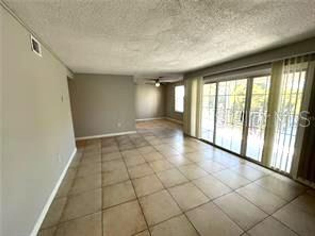 Photo of 4174 Versailles Drive #4174D, Orlando, FL 32808 (MLS # O6381440)