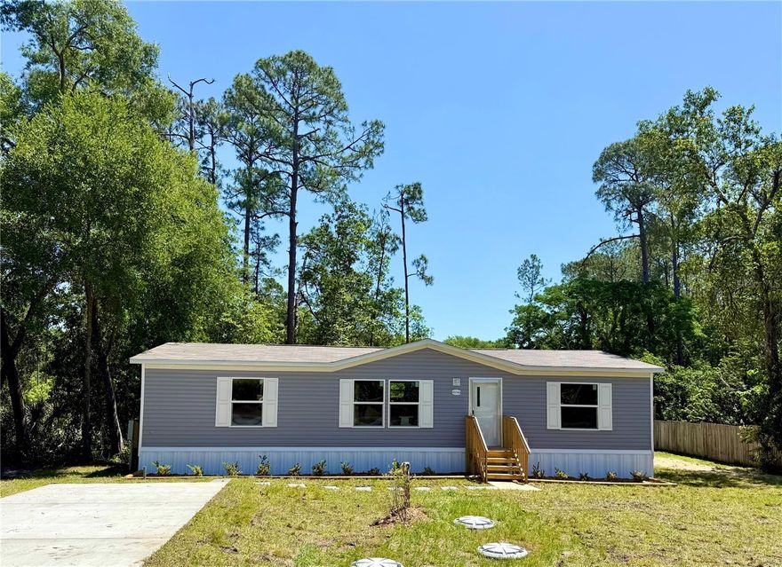 MOVE IN READY! NEW Double Wide manufacture home offers 1,265 square feet of comfortable living space, featuring 3 bedrooms and 2 bathrooms, perfectly situated on a spacious .35-acre lot (110x140) the serene view of Lake Grace right in your backyard—Enjoy peace and privacy with NO HOA FEES, giving you full control of your space. The home is equipped with surge protection, and it comes with a 5 Year Home Buyer Protection Plan covering major structural defects, Central Air, Plumbing system, Hot water heater, Electrical System Appliances and Central Heating System. Clearwater Lake is just a short 3-mile drive away, offering even more opportunities for recreation, and the nearby Florida Trail Clearwater Lake Trailhead is perfect for outdoor enthusiasts. ZONE AGRI