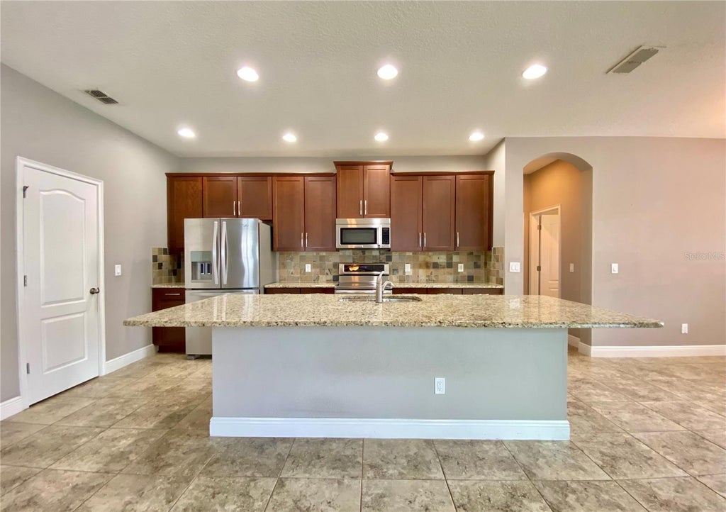 Photo of 12844 Woodmere Close Drive, Windermere, FL 34786 (MLS # O6451398)