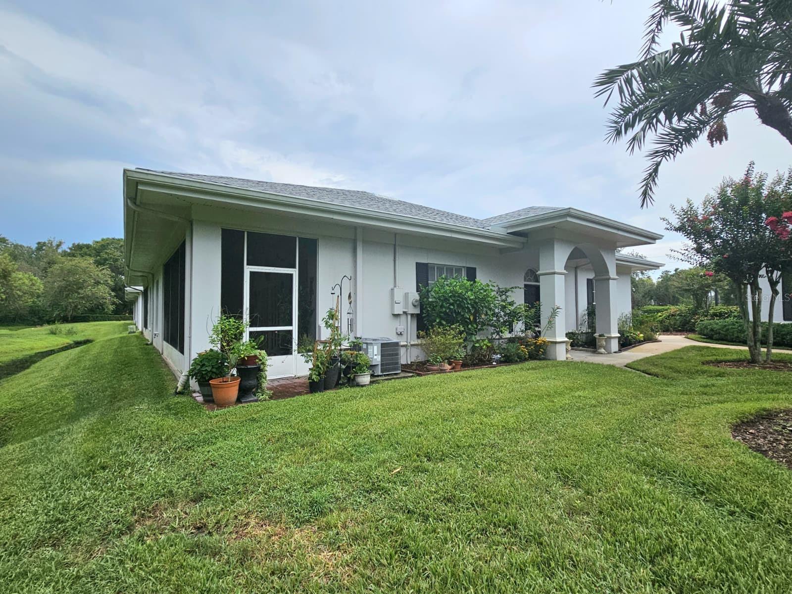 Discover this very Desirable Diamond! This Contemporary 2 Bedroom, 2 Bathroom Townhouse Conveniently Located Near Major Highways such as Veteran's Expressway and Citrus Park Dr. Near the Citrus Park Mall and a short walk to High End Restaurants and Shopping. Enjoy the Gorgeous Natural Lighting and High Ceilings that this End Unit Villa has to offer. The French Doors lead you out to a Screen-In Covered Lanai that is Perfect for Entertaining while Enjoying the Peaceful View of The Conservation Area. The Huge Primary Bedroom has an Oversized Walk-In Closet and a Handicapped Accessible Full Bathroom. New Roof 2024, A/C 2023, Water Heater 2020, and the New Water Softener with Water Conditioner in 2025 (located within the Oversized Closed In Car Garage). Ring Doorbell. Your Home Exterior and Yard Maintenance are Included within The Low HOA. Just minutes to Tampa International Airport and To The Beautiful Sunny Florida Beaches! See it Today!