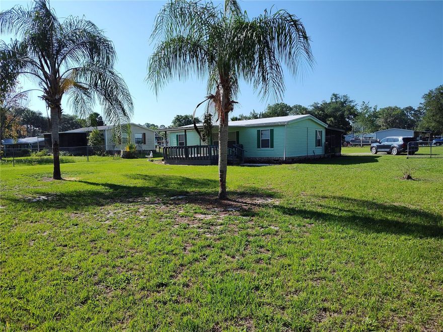 Enjoy country life, with almost three quarters of an acre of beautiful cleared, chainlink fenced land just a mile to the boats ramps of the St. John's River and Lake George, and only a short walk to the Ocala National Forest! Nature surrounds you in the small river town of Astor. This well layed out 3 bedroom/1 bath home comes mostly furnished, and has been very well kept. The back screened back porch runs the length og the home, and is great for quiet evenings as well as family barbecues and the huge fenced yard allows ample space for pets and everyone else to enjoy their hobbies. The connex storage room and a 25x25 carport stays with the property! Ample space for all your toys and pets. No HOA, and you own the land! Take a look today!