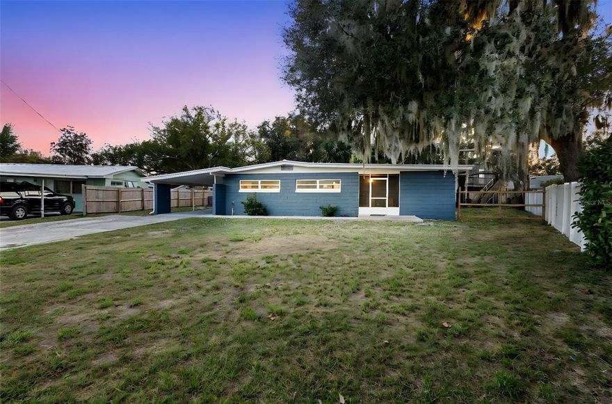 Discover a quietly impressive four-bedroom, two-bath pool home designed for comfortable living and effortless everyday enjoyment. A screened front porch welcomes you inside, where the spacious main living area opens to a spacious kitchen featuring granite counters, an island with breakfast bar, generous pantry storage, and a bright eat-in nook. Just off the kitchen, a large laundry room offers additional convenience, with the washer and dryer thoughtfully included. The kitchen flows seamlessly into the living room, creating an easy gathering space that extends out to a screened patio running the full length of the home—ideal for relaxing or entertaining. The primary suite offers a large walk-in closet and private bath. Two additional bedrooms also feature walk-in closets, and the fourth includes a full-length closet, providing exceptional storage throughout. A dedicated linen closet in the second bath adds even more usefulness. Outside, a large fenced yard hosts an above-ground pool with surrounding deck, plus a unique two-story structure offering abundant open storage below and a framed-in upper level with its own balcony—ready for customization as a workshop, studio, or retreat. With no HOA, there’s room to bring your boats, RVs, and other toys. A property with this much space and potential is a rare find. Schedule your showing and experience it for yourself.