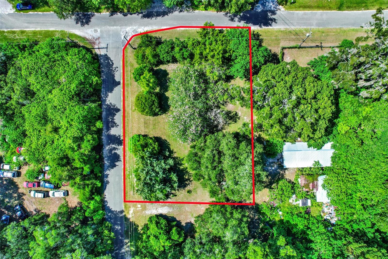 Welcome to 847 NE 31st Street, a beautifully maintained corner lot nestled in the heart of Ocala, Florida. This rare opportunity offers a spacious parcel adorned with mature flowering trees, lush greenery, and plenty of natural privacy, making it an ideal canvas for building your dream home or investing in future development. The lot is level and cleared with easy access to utilities, surrounded by paved roads and tucked away in a peaceful neighborhood setting that offers both seclusion and convenience. Whether you're planning to build immediately or hold as an investment, this parcel presents endless potential with no HOA restrictions to limit your vision.
Located just minutes from Ocala’s bustling downtown district, you'll enjoy proximity to top-rated restaurants, shopping centers, and entertainment venues such as the Reilly Arts Center, Ocala Civic Theatre, and historic Downtown Square. For outdoor enthusiasts, the scenic Silver Springs State Park is just a short drive away, offering kayaking, glass-bottom boat tours, and nature trails. Healthcare is also easily accessible, with AdventHealth Ocala and HCA Florida Ocala Hospital within a convenient distance. Additionally, this location provides quick access to major roadways like US-301 and I-75, making commuting throughout Marion County and beyond a breeze.
This is a prime opportunity to secure a valuable piece of real estate in one of Central Florida’s fastest-growing regions. Don’t miss the chance to bring your vision to life in a thriving community surrounded by natural beauty, established infrastructure, and everything Ocala has for you.