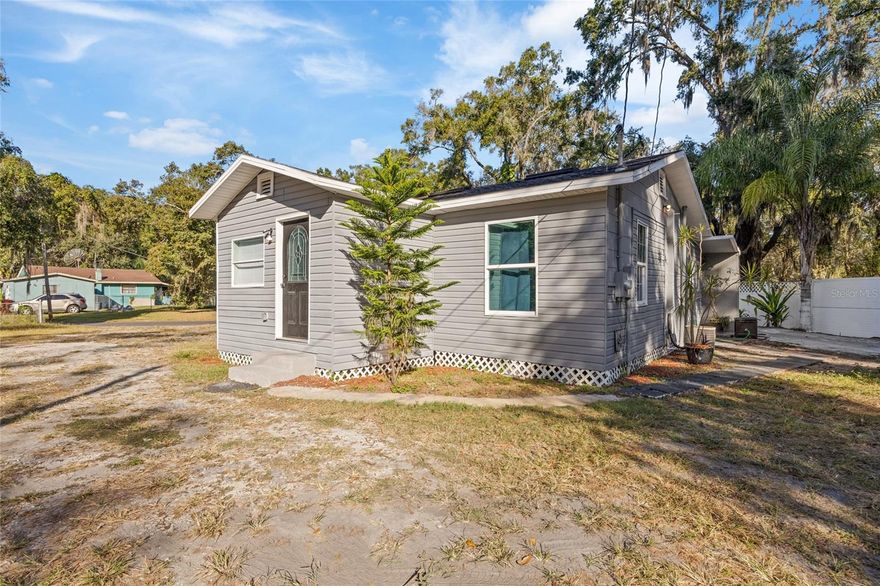Welcome to this adorable 2-bedroom, 1-bathroom home that’s cute as a button and full of character! Whether you’re searching for the perfect starter home or an investment opportunity, this one checks all the boxes.

Situated on a spacious corner lot, you’ll love being just minutes from downtown Plant City, where community events and small-town charm are part of everyday life.

Inside, you’ll find an extra flex room that can easily serve as a third bedroom, office, or game room, giving you space to grow and personalize. The home has been well cared for and updated with new windows, drywall, vinyl siding, and flooring over the years, maintaining its cozy charm while offering modern comfort.

Step outside to enjoy a fully fenced yard (except for the driveway), providing plenty of room for entertaining, or parking your recreational vehicles. There’s also a 13x20 insulated workshop built with commercial refrigeration panels, ideal for hobbies, projects, or storage.

With no HOA, CDD, or deed restrictions, you’ll have the freedom to truly make this home your own.