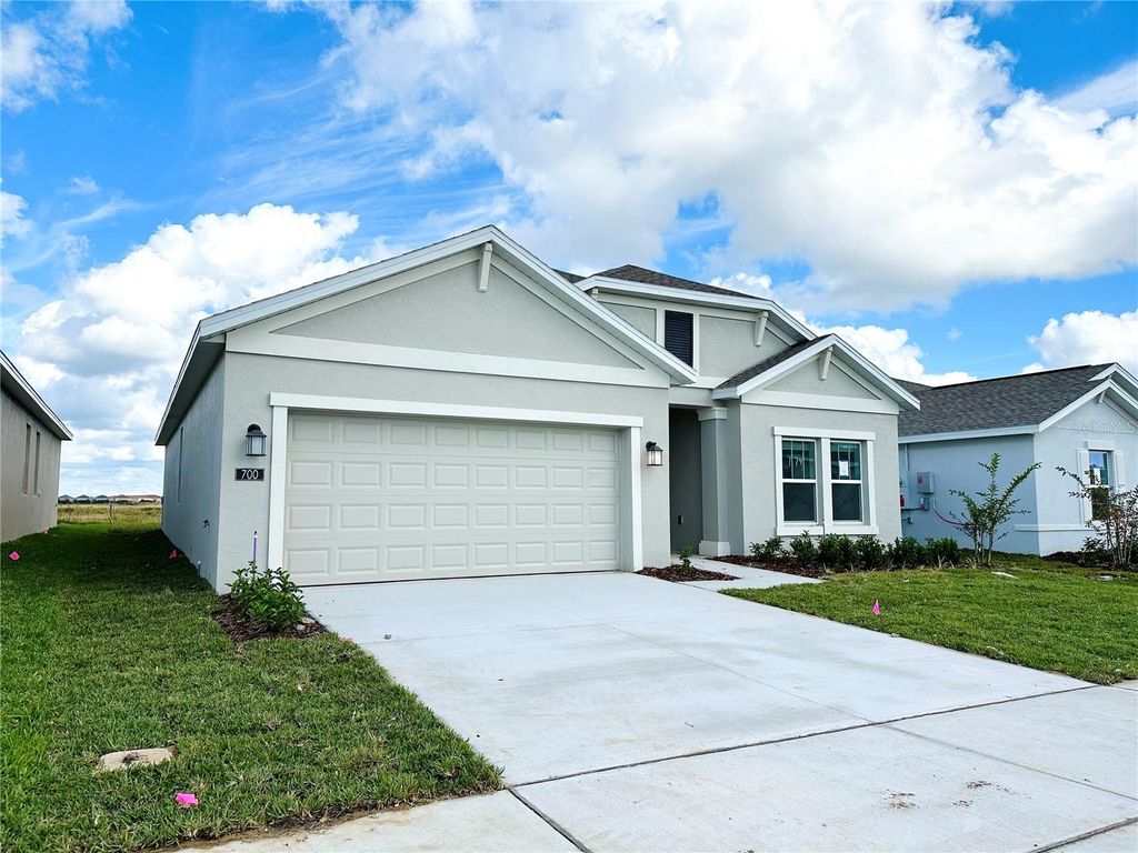 Photo of 700 Daring Drive, Davenport, FL 33837 (MLS # O6400437)