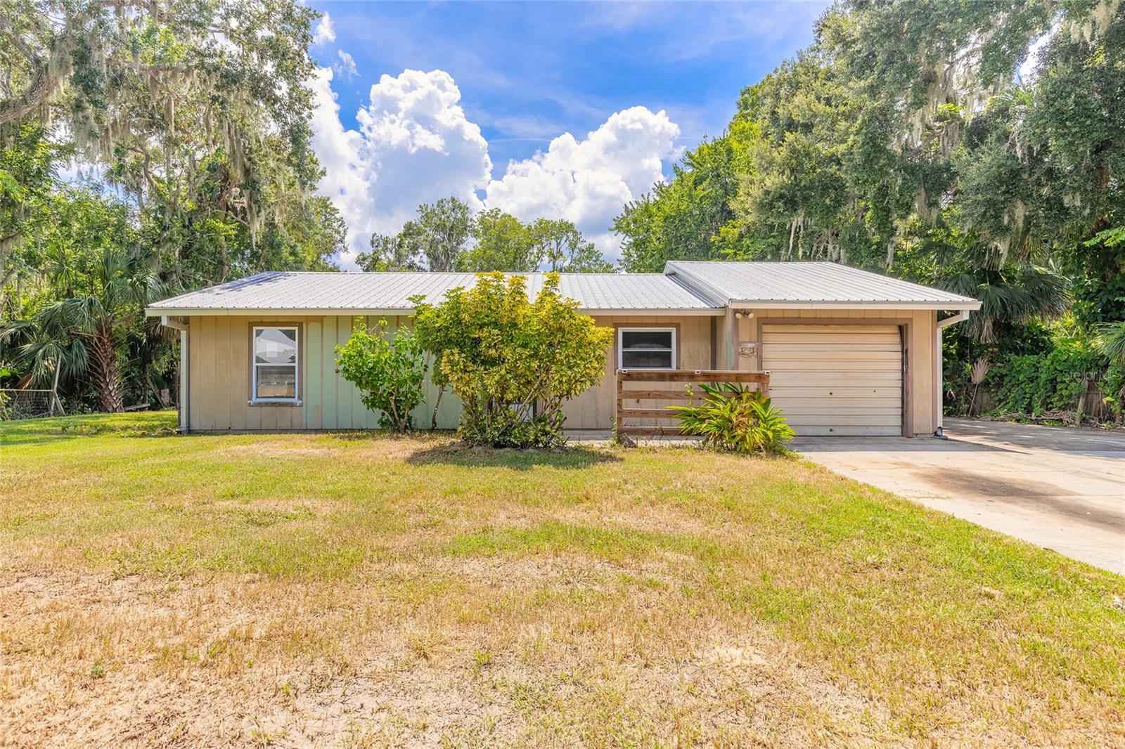 Unlock the Potential of This Spacious New Smyrna Beach Property! Looking for space and a chance to create your dream home? This expansive 3-bedroom, 2-bathroom property sits on nearly half an acre (100 x 200 lot) in unincorporated New Smyrna Beach — offering endless possibilities for renovation, home expansion, addition of a pool, recreational area, pole barn or workshop, while still having land to park work vehicles or your toys. Inside, you’ll find a wide-open floor plan with nearly 2,000 square feet of living space, large rooms, high ceilings, plus an inside laundry room and a deep 1-car garage. This home is a blank canvas just waiting for your personal touch. Enjoy a peaceful, country-style neighborhood that’s still close to schools, shopping, the major highways and just a short drive to the beach. This home is eligible under the First Look Initiative – Owner-occupant offers will be considered after 7 days on market and investor offers after 30 days, however you may submit your offer anytime during the First Look period! Don’t miss your chance to turn this diamond in the rough into a gem of a home! There are no warranties expressed or implied. All measurements are approximate. Square footage received from tax rolls. All information recorded in the MLS intended to be accurate but cannot be guaranteed. Buyers should check city zoning for rental restrictions.- All offers are subject to OFAC clearance.