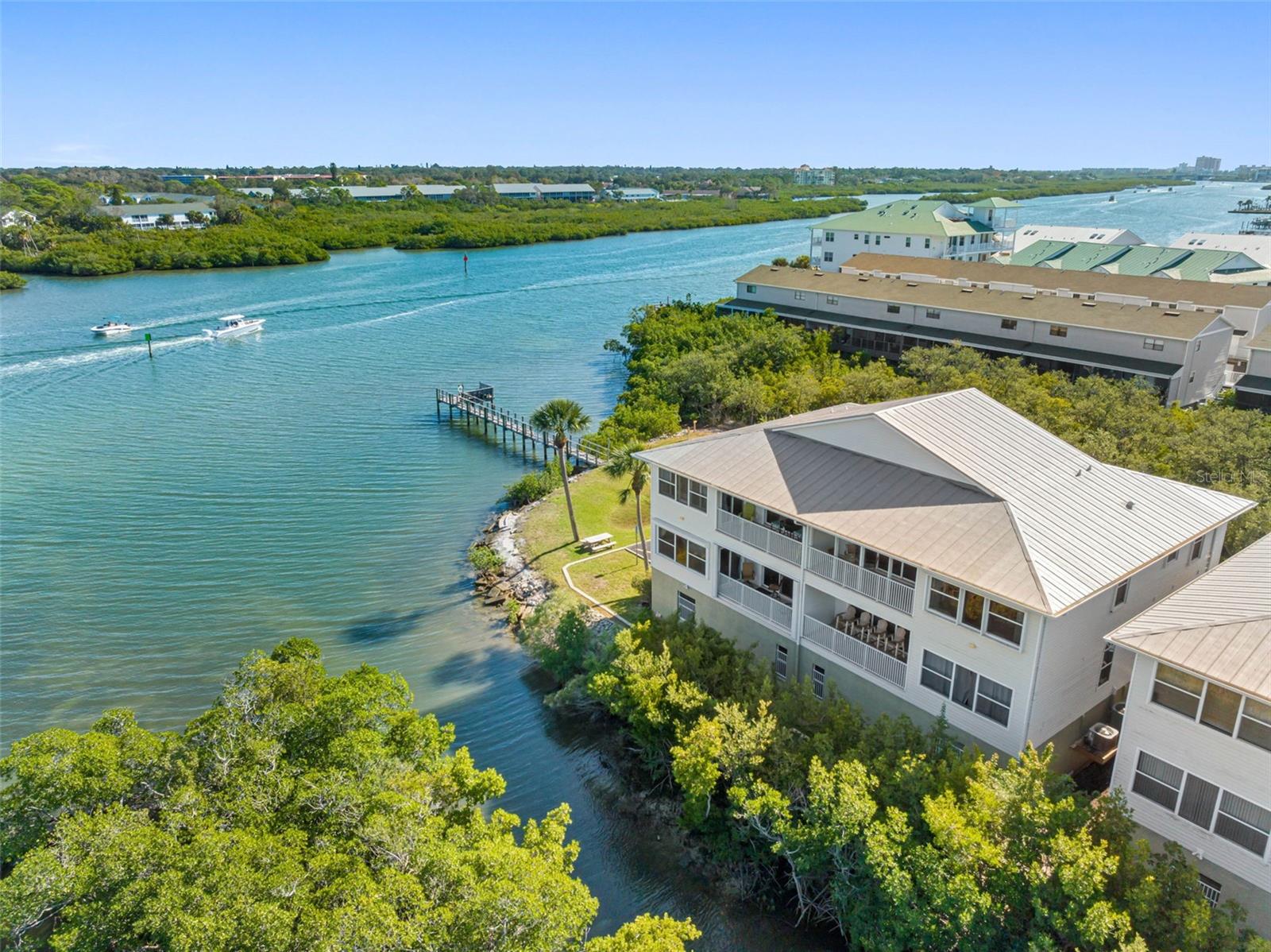 This Large top floor weekly rental corner unit is perfect to relax on your vacation! inquire for detailed weekly and monthly rates. This is the only unit at Mariners Pointe that has water views from every room, our guest have spotted manatees, dolphins, and a variety of birds and fish from their balcony. The enormous master bedroom has beautiful water views a king size bed, smart tv, oversized chair walk in closet and a brand new fully remodeled bathroom with walk in shower and double sinks. The kitchen is open to the family room, there is a full size garage, washer and dryer in the unit, and a large balcony overlooking the waterway with Adirondack chairs and a bistro table with two chairs. The second bedroom has a queen bed more beautifully water front views and smart tv. We provide free beach equipment and toys. Heated pool, grill and the local trolley bus stop is in front of the complex! Located on the great Indian Shores Indian Rocks Beach Neighborhood! Walk to the beach and enjoy all we have to offer. Watercraft rentals are just a short walk away and a convenience store next door! Cleaning fee $200, booking fee varies according to type of payment, Tax 13%