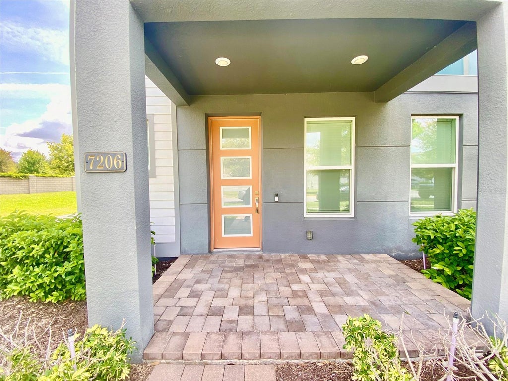 Photo of 7206 Carrickbend Lane, Orlando, FL 32819 (MLS # O6432856)