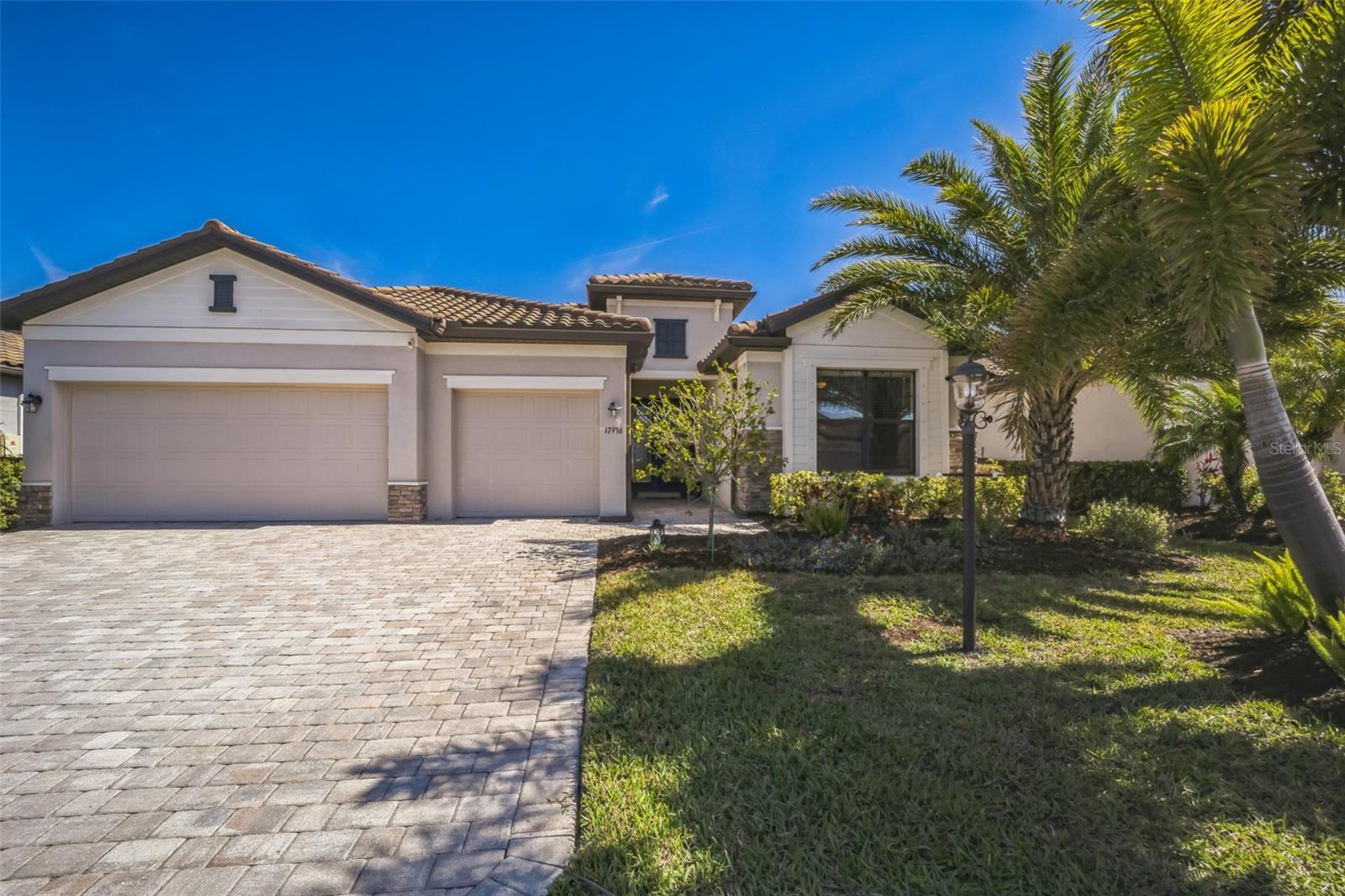 Welcome to your Florida dream house. This beautiful and highly desirable Summerville II is situated in the amazing, master-planned community of Lakewood Ranch. As you enter the home, the vacation ambiance of this open-floor plan is immediately apparent with its large glass slider that provides views of the pool, lush landscaping, and a lake. This home has a lot of exciting features including 3 bedrooms, 3 full baths, a bonus room, and a 3-car garage. You'll find granite countertops in the kitchen and laundry, and beautiful white quartzite in all of the bathrooms. Luxury vinyl plank flooring is in all bedrooms and the bonus room, with ceramic tiles throughout the rest of the home. This wonderfully appointed home has tray ceilings, crown molding and an oversize kitchen that features a large dining area, almost 12' of island seating, stainless steel appliances, and a large ungraded kitchen sink and faucet...all perfect for entertaining guests. The spacious primary bedroom suite is gorgeously appointed with a tray ceiling, crown molding, a large soaking tub, a large walk-in shower, vanities on both sides of the bathroom, and you'll absolutely love the 2 large, walk-in closets with built-ins to maximize your storage space. Ceiling fans are located throughout the home. Polo Run is a gated neighborhood and amenities include a large, resort style heated pool, a fitness room, a yoga room, bocce ball, basketball courts, tennis courts, pickleball courts, a dog park, and a community center with grills, a playground and an outdoor shower. Lakewood Ranch is a fantastic community that has something for everyone including great shopping, fine dining, easy access to SRQ airport, and it's just a short drive to Siesta Key, one of the top beaches in America. You'll love this community. Please schedule your appointment to visit today. You'll be happy that you did.