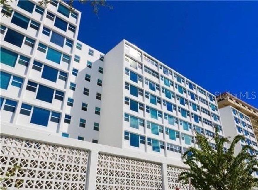 Your pied-à-terre for city living in Sarasota awaits you in Gulfstream Towers! Where fully renovated interiors meet panoramic Sarasota Bay and Marina Jack views. This move-in ready residence offers the ideal combination of waterfront living, walkability, and flexible space design in one of downtown Sarasota’s most desirable locations. This light-filled residence features impact windows and doors and expansive glass framing unobstructed views of Sarasota Bay and Marina Jack. The interior has been fully renovated with high-end finishes, highlighted by a modern galley kitchen with quartz countertops, large single-basin sink, wine cooler, sleek cabinetry, stainless steel appliances, water filtration system, and LED accent lighting, all flowing seamlessly into the open living and dining areas. A standout feature is the Clei Italian custom-built Murphy bed system, allowing the space to effortlessly transition between a living area and bedroom, ideal for full-time living, seasonal use, or a lock-and-leave lifestyle. Additional highlights include tile flooring throughout, contemporary finishes, efficient layout, and abundant natural light.
Located in a secure waterfront building, residents enjoy amenities including a heated pool with expansive furnished sun deck, fitness center, private storage, community/entertaining room with full kitchen and dining area, library, bike storage, and laundry facilities on each floor. With only 9 units per floor, the building offers a quiet, boutique feel. Prime downtown Sarasota location—just steps to Marina Jack, Bayfront Park, Selby Gardens, award-winning restaurants, theaters, the Sarasota Opera House, and year-round cultural events. Complimentary trolley service provides convenient access to St. Armands Circle and Lido Key beaches. Buyer to verify all measurements, HOA fees, rental restrictions, and pet policies.