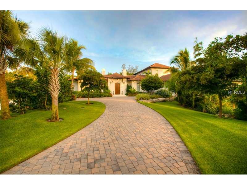 Own the best. Former Parade of Homes Winner in it's class: Best Curb Appeal, Best Kitchen, Best Master Suite, Best Architectural Detail, Best Overall in it's Class. The attention to detail in this home and the quality of it's materials are what set this home apart from the rest. Designed by Clifford Schultz and built by master builder Richard Perrone, this home exudes quality and style. From the custom wood front door you enter in to a beautiful formal living room overlooking the chic pool area, complete with multi colored lighting system for an amazing show in the evening . An outdoor living room abuts the soft water pool and kitchen/family room and boasts a gas fireplace, the perfect place to relax day or night. The award winning kitchen is a chef's dream featuring a wolf cooking system and lots of space for entertaining and opens to the family room. This home is loaded with upgrades including 3 security cameras, lite touch electrical system, landscape lighting, auto electric shades and a water purification system to name just a few. Spice Bay is a private enclave of just 14 homes on the south end of Siesta Key, which offers easy access on and off the island year round. The home comes with a deeded boat dock complete with 7,000 LB lift. The epitome of style and grace, this home is a must see for the discerning buyer. Owner requires a lease back of the home until their new home is complete, please inquire for details. Agent is related to seller.