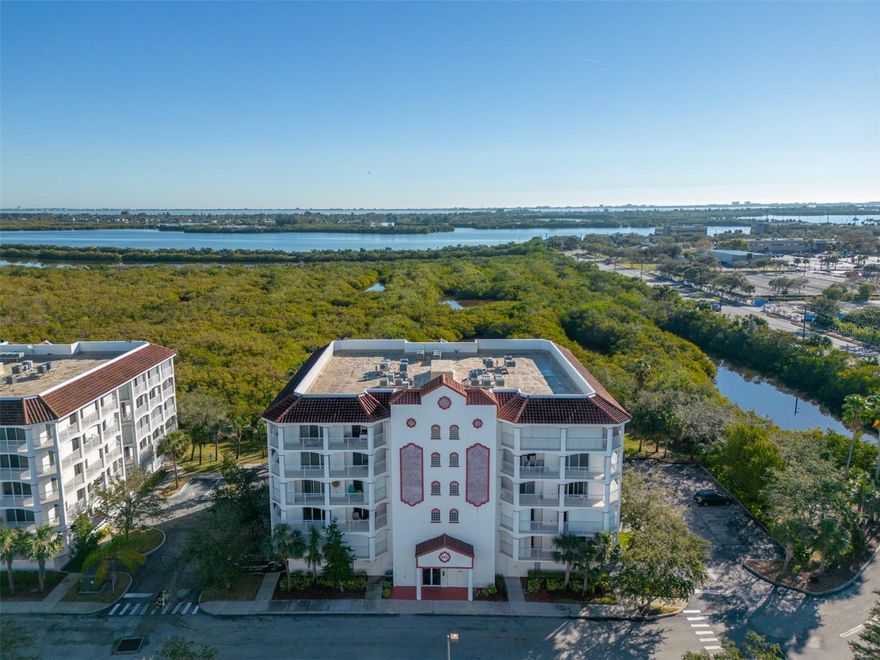 Wake up to panoramic preserve and wildlife views with a front-row seat to rocket launches from your private wraparound balcony! This bright 5th-floor penthouse unit offers an open layout with 3 beds, 2 baths and abundant light from floor-to-ceiling sliders and plentiful windows. The open kitchen features an expansive granite breakfast bar, stainless appliances and stunning bright white cabinetry. The primary features a spa-like en suite bath with jetted soaking tub, walk-in tiled shower, dual vanity and two walk-in closets. Each bedroom features its own private balcony access. Upgrades include 2026 HVAC, 2016 water heater and newer marble-tile and wood-laminate flooring. A laundry/utility room adds convenience, and electric storm shutters and secure underground parking offer year-round peace of mind. Residents enjoy a pool, spa, fitness center, gazebo, and clubhouse in a pet-friendly community. In the heart of Merritt Island, minutes from the new hospital, shopping, dining & the beach.