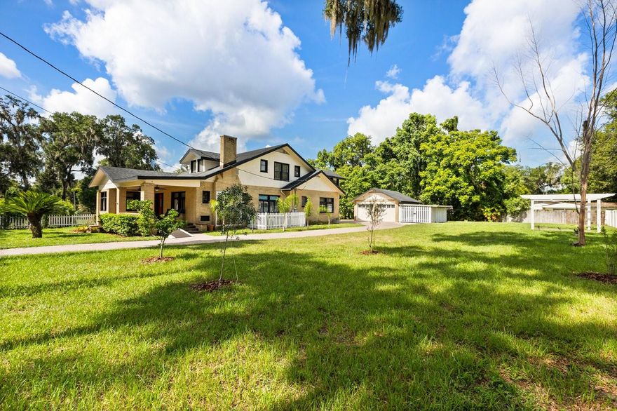 One or more photo(s) has been virtually staged. This 1926 historic home in downtown Orange City is a rare find offering five bedrooms three bathrooms a study/den and even a basement on nearly half an acre. Solid low maintenance original brick construction built when masonry was truly an art. This home offers 5 bedrooms 3 bathrooms a study/den and even a rare basement all on nearly half an acre shaded by majestic oaks. The primary suite and bath are located downstairs along with a spacious study or den. Upstairs you’ll find 3 large bedrooms 2 full baths providing ample room for family and guests. The flow through open plan showcases original hardwood flooring throughout blending historic charm with modern updates. Thoughtful improvements completed in 2015–2016 include a new roof, full electrical rewire, updated bathrooms, granite countertops, 42” cabinetry and a tankless water heater. A recently added stone accent wall enhances the home’s character while preserving its timeless appeal. Outdoor features include a detached 2 car garage with carport a brick patio created from the home’s original fireplace bricks an extended pavered driveway a pergola and plenty of space for entertaining or projects. This property is part of Orange City’s historic area where timeless craftsmanship meets modern comfort. Conveniently located near Blue Spring State Park and the St. Johns River this home offers both history and lifestyle an extraordinary opportunity you won’t want to miss.
