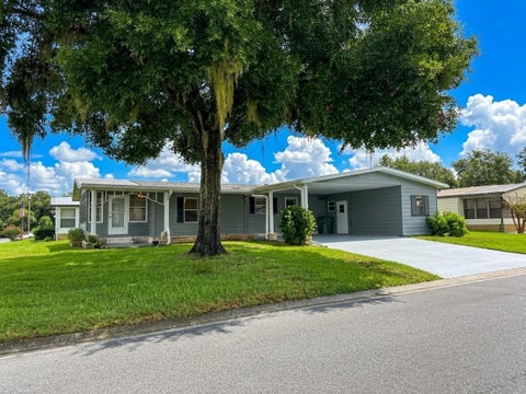 Photo of 2353 W Coach N Four Drive, Leesburg, FL 34748 (MLS # O6441506)