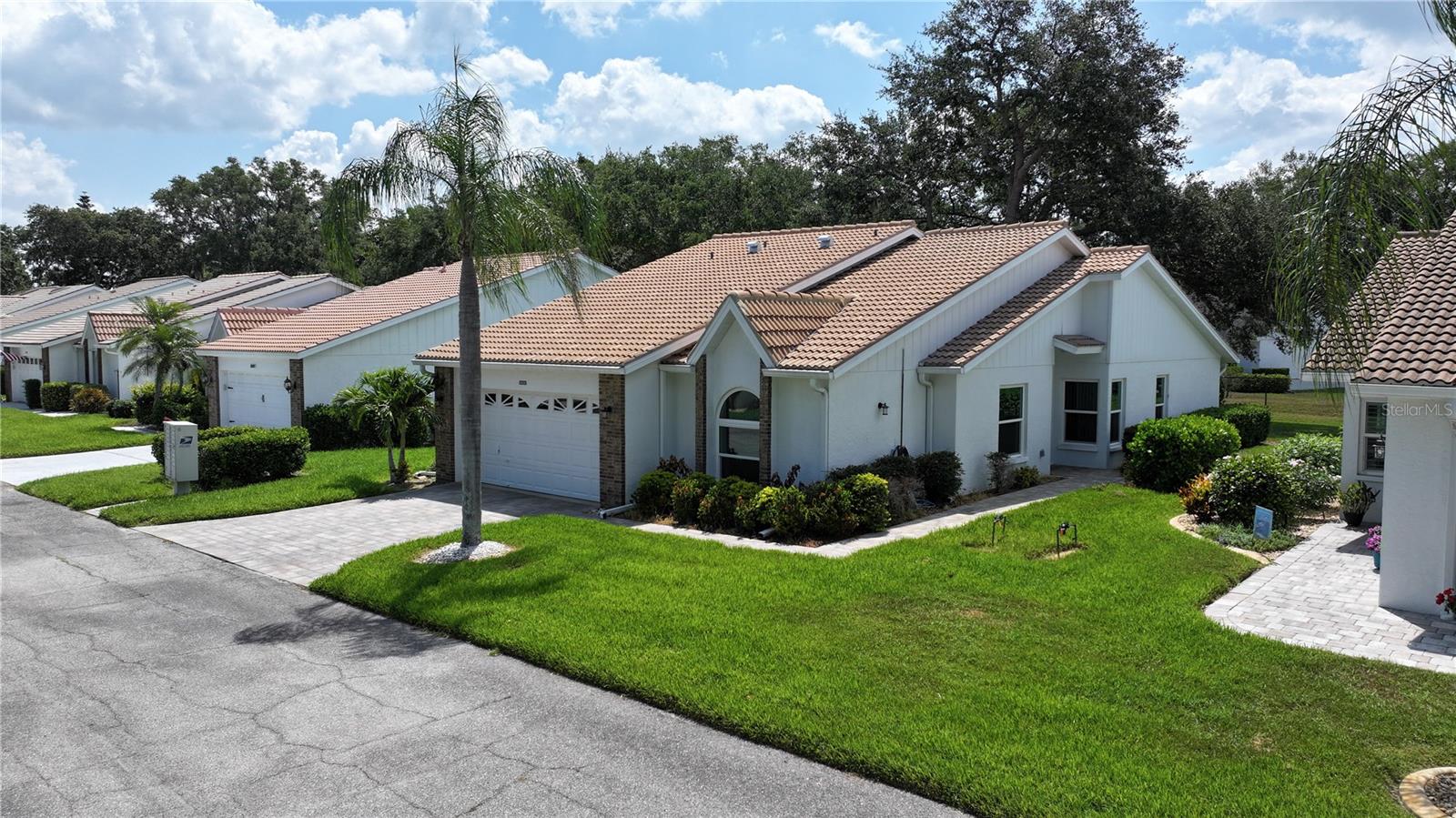 Welcome to Garden Lakes, a highly sought-after 55+ gated community offering a perfect blend of nature, convenience, and exceptional amenities. This beautifully updated villa is nestled in a serene setting, providing maximum privacy with a picturesque backyard featuring a stunning grand oak tree. Meticulously maintained, this home boasts vaulted ceilings, an updated kitchen with stylish shaker cabinets, and stainless-steel appliances. Whether you prefer indoor comfort or outdoor relaxation, this home offers endless opportunities for both. Unwind with a peaceful sunset from your spa-inspired lanai or take a morning stroll along the charming walking paths woven throughout the community.
Enjoy a truly maintenance-free lifestyle, as the villa's exterior upkeep is covered. Recent upgrades include a BRAND NEW ROOF (February 2025), a new AC unit (2022), modern kitchen appliances (less than two years old), new front yard pavers (2021), lanai pavers (2023), complete repiping (2021), Hurricane Impact Windows, and a new electric panel (2022). With all these updates, all you need to bring is your toothbrush!
Garden Lakes offers an array of resort-style amenities, including a clubhouse, a heated pool, an updated community kitchen, a meeting room, a billiard room, a community room, and a library. For those with an active lifestyle, enjoy access to a fitness center, tennis and pickleball courts, as well as shuffleboard courts. HOA fees conveniently include **cable, internet, and yard irrigation.
Ideally located near Lakewood Ranch, UTC, I-75, top-tier golf courses, shopping, dining, and entertainment, this rare gem provides the perfect balance of tranquility and accessibility. **Homes in Garden Lakes are in high demand—schedule your private tour today and discover your dream Florida retreat!