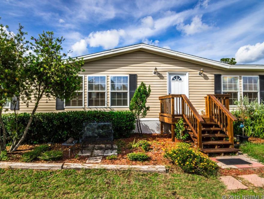 SPACIOUS AND BEAUTIFUL HOME ON 2.5 ACRES!! 3 bedroom 2 bath home manufactured in 2003 with a large 5 stall horse barn on 2.5 acres.  This home features a split floorpan, fireplace, new roof, new wood laminate floors in 2013, lighted horse corral, 2.5 acres cleared and fenced.  This well taken care of home will not last long.