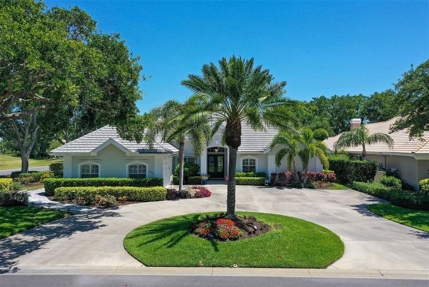Welcome to your new residence in The Reserve, the premier, gated section of Plantation Golf and Country Club. This home has recently undergone a total transformation, combining a classic floor plan with stylish selections and modern conveniences. The impressive front facade is enhanced by double leaded glass entry doors and is the perfect prelude to the remarkably refined living spaces. A gourmet island kitchen with top of the line Thermador and GE Profile appliances, and a built in beverage cooler opens to the generous family room with a fireplace. The dining room is spacious, has a wet bar with glass cabinetry, a wine cooler and views of the pool, lanai, and 4th green of the Panther course. The 2021 renovated Pebbletec saltwater pool is nearly 30 ft. long, perfect for laps, and is surrounded by a leathered white pearl marble deck. The complete renovation in 2019 also included a new tile roof, tankless hot water heater, security system, hurricane protection, HVAC, and a Generac generator for the entire home. Plantation shutters and custom window treatments throughout, premium luxury vinyl flooring, ceiling fans, and 2022 Maytag washer and dryer are just part of the extras this lovely home has. There are 4 bedrooms, 4.5 baths, an office/den and the primary suite is spacious enough for a reading or sitting area. The corner lot is just over a half acre, is beautifully landscaped, and offers privacy. If you're looking for the perfect residence that doesn't need anything, this special home is for you. The interiors and exterior were custom designed by Missi Youngblood of Venice. Plantation has two 18 hole golf courses, tennis, pickleball, swimming, dining, and social activities for everyone. Conveniently located near beaches, the island of Venice, and minutes to Sarasota's fine arts museums and international airport.