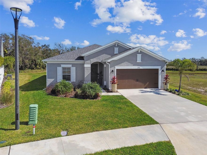 Welcome to your dream home in the highly sought-after Riverfield neighborhood of North River Ranch, Parrish, Florida. This exquisite 2024 Cardel-built residence offers 4 spacious bedrooms, a dedicated office, a versatile flex/bonus room, and 3 full bathrooms, all thoughtfully designed to cater to modern living.

**Key Features:**
- **Gourmet Chef's Kitchen:** The heart of this home boasts 42-inch cabinets, pristine quartz countertops, and sleek ceramic tile flooring, creating an ideal space for culinary enthusiasts.  **Scenic Pond View:** Situated on a premium lot, enjoy tranquil pond views that provide a serene backdrop to your daily life. **Ample Parking:** A spacious 2-car garage ensures ample storage and parking solutions.
**Community Amenities:**
North River Ranch is an award-winning master-planned community that offers an unparalleled lifestyle with top-notch resort-style amenities and abundant outdoor activities. 
- **Resort-Style Pools:** Dive into relaxation with access to multiple community pools, perfect for unwinding or socializing.
- **Clubhouses:** Enjoy the Brightwood Pavilion and Riverfield Verandah, featuring fitness centers, game rooms, event lawns, and more. Extensive Trail System:** Explore miles of interconnected trails designed for walking, biking, and jogging, promoting an active and healthy lifestyle. 
- **Fitness Facilities:** Stay fit with outdoor fitness stations, a state-of-the-art fitness center, and sports courts available within the community.
- **Community Events:** A dedicated Director of Fun ensures a calendar full of events and activities, fostering a vibrant and connected community atmosphere. 
**Convenient Location:**
Nestled in North Manatee County, North River Ranch provides easy access to major highways, making commutes to Sarasota, Tampa, and St. Petersburg a breeze. Within the community, you'll find shopping, dining, medical services, and brand-new schools, ensuring all your essential needs are met close to home. 
Experience the perfect blend of luxury, convenience, and community in this exceptional Cardel home. Don't miss the opportunity to make this stunning property your own and everything at North River Ranch