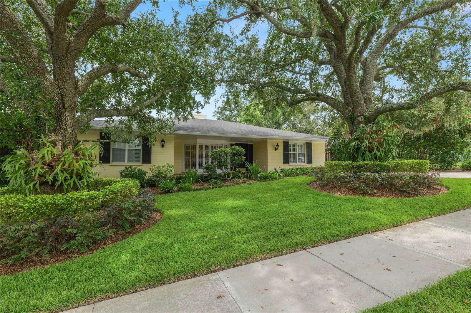 This fabulous hidden gem has it all!! Just steps from iconic Lake Hollingsworth, with spectacular views from the front yard :) With over 3000SF of well appointed comfort, the possibilities for this home are endless. A generous open floor plan, wood floors, built ins, custom moldings, cabinetry and wallpapers, plantation shutters, whole home generator, new roof and spectacular back yard with an glissening inground pool- put this home over the top. This perfect location is close to everything, from walks around Lake Hollingsworth, to shopping and dining, downtown, Florida Southern College, Bonnet Springs park and all main thoroughfairs. There is nothing not to love about this remarkable property!!
