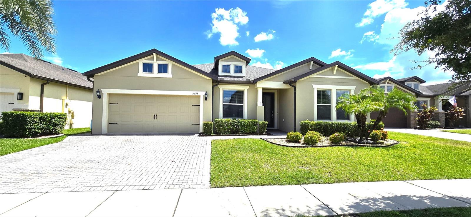 One or more photo(s) has been virtually staged. This beauty fully upgraded home in the Lakeshore at Narcoossee community offers a luxurious and convenient lifestyle near Lake Nona’s Medical City and Lake Nona Town Center. Desirable Dockside Model Featuring a bright, open single-story layout with 4 bedrooms, 3 Full baths, and a 3-car TANDEM GARAGE, Brand new 2025 Roof it’s perfect for modern living and entertaining. The gourmet kitchen boasts ample cabinetry, a large granite island, built-in convection oven as gourmet kitchen, microwave, glass cook-top, and a spacious walk-in pantry. Engineered wood floors unify the main living areas, which open to an extended covered patio upgraded with a beautiful half of patio are cover with pavers and oversized backyard—ideal for gatherings. The master suite includes a sitting area, a large walk-in closet, dual sinks, and a generous walk glass shower. Additional highlights: extend brick paver driveway , oversized laundry room with laundry tub, and surround sound connections. Residents enjoy top-rated schools, community amenities like a pool, dog park, basketball court, fitness center, and lake access with boat slips. Perfect for fishing and outdoor fun! Schedule your private showing today!