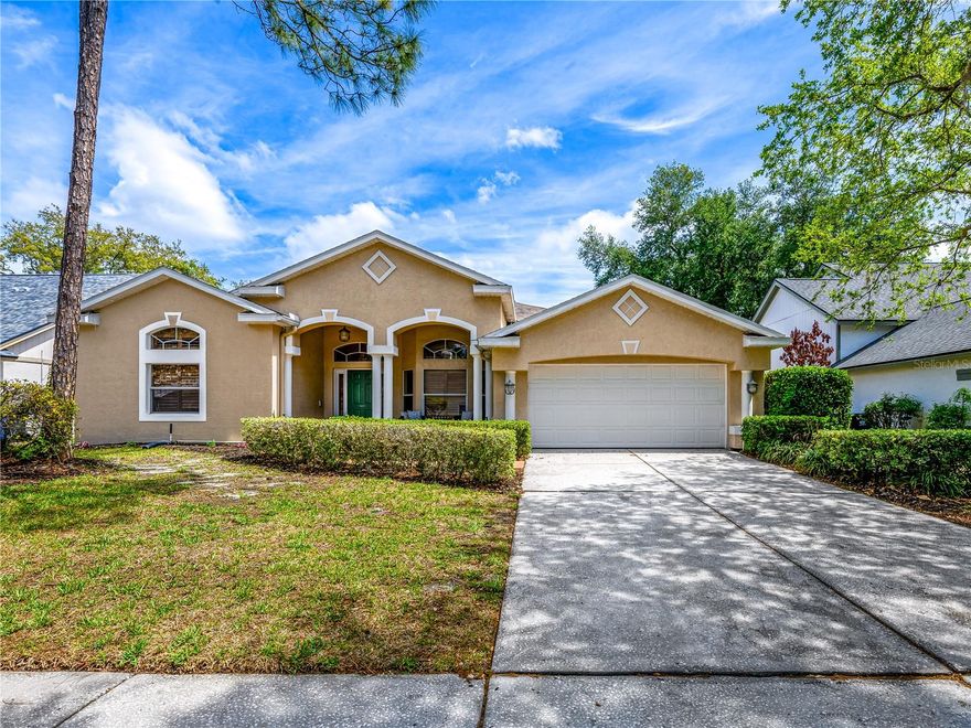 This beautifully maintained 4-bedroom, 3-bath, single-story POOL HOME is the popular Cambridge model built by Lennar and located inside the village of The Enclave in the highly sought-after community of Tampa Palms.  At 2,418 sq ft, this home offers a SPACIOUS open layout with a split-bedroom floor plan, high ceilings, crown moulding throughout, providing FLEXIBLE living spaces designed for both everyday COMFORT and EASY entertaining. The kitchen features GRANITE countertops, stainless steel appliances, GAS COOKTOP, generous prep space WITH STORAGE, and bar seating overlooking the family room and screened pool/spa area. The private primary suite is oversized with a sitting room adjacent perfect as a home office, exercise area, or quiet reading area.  The UPDATED ensuite includes a large bath with soaking tub, walk-in shower, and dual vanities.  Step outside to your screened lanai with pavers & enjoy the POOL and spa.  With an extra seating area, this is the ideal setup for relaxing weekends, outdoor dining, or hosting friends and family.  The charming front porch, mature landscaping, and 2-car garage add to the home’s curb appeal.  Updates include NEW gas water heater (2026), Refrigerator (2025), Roof (2015), AC (2015).  TAMPA PALMS delivers a lifestyle and value that is hard to beat in Tampa!  You’re choosing an ESTABLISHED NEIGHBORHOOD with GREAT SCHOOLS, community parks, optional country club membership, PLENTY of green space, and a true community feel made even better by the nearby New Tampa Performing Arts Center, bringing LOCAL THEATER and year-round arts programming to the area.  If you want to get out of the house and want some OUTDOOR FUN, you’re super close to Flatwoods Conservation Park, where you’ll find walking trails, biking, and room to enjoy Florida without being packed on top of everybody else. FLATWOODS includes multiple access points and is known for its paved multi-use trail system, while New Tampa Nature Park connects into that broader trail network.  DINING OPTIONS are strong too with well-known local favorites like Stonewood Grill & Tavern, Don Julio’s Authentic Mexican Cuisine, Liang’s Bistro, Via Italia, and many other great restaurants within a 2 mile radius.  Daily errands are made easy with Publix, Aldi, Sprouts, BJ’s, Super Target, and Walmart Supercenter nearby, and when it is time for a little serious retail therapy, both The Shops at Wiregrass and Tampa Premium Outlets are just a SHORT DRIVE away.  Medical facilities are also abundant with Advent Health, Moffitt and the James A. Haley VA center just minutes away.  With EASY access to I-75, I-275, I-4, and S.R. 56/54, you are never too far away from work or fun.  Schedule your private tour today.