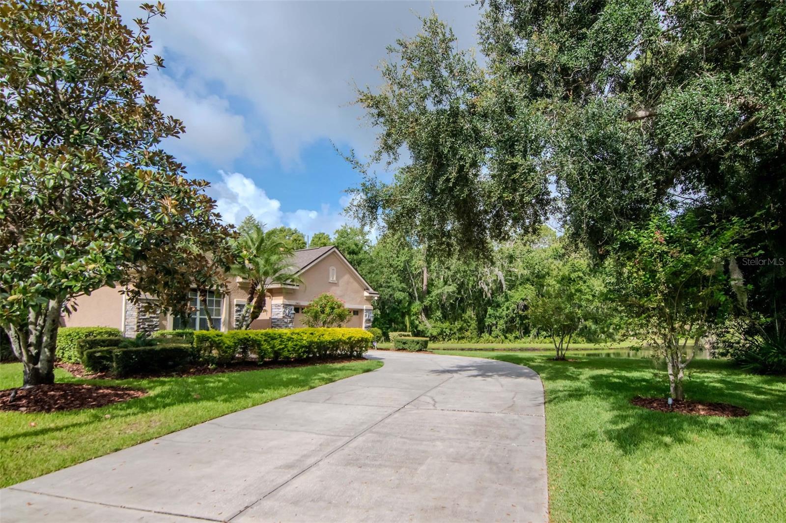 Beautiful and spacious cul-de-sac home on an oversized premium lot with serene pond and conservation views. This property offers extensive upgrades inside and out. The backyard is ideal for entertaining with a custom outdoor kitchen featuring a grill, warming drawer, large burner, refrigerator, and ice maker. Enjoy the screened lanai with pavers, a/c-cooled storage, and a dedicated pool bath.
Inside, the modern kitchen includes a 6-burner Viking gas range and Viking dishwasher. The primary suite features a tray ceiling with ambient lighting, a large custom walk-in closet, garden tub, walk-in shower, and separate water closet.
Perfect for multi-generational living, the in-law suite includes a private living room, bedroom, and bathroom. Upstairs includes a second oversized primary bedroom with walk-in closet, a large guest/game room, and an office/flex space with closet (possible 6th bedroom). A second-floor balcony overlooks peaceful views.
Additional features include: 5-zone whole-home audio system, 4-zone A/C on the first floor, dry bar, owned alarm system, and newer A/C units, water heater, and pool heater. New carpet recently installed. Move-in ready and meticulously maintained. Refrigerator do not convey.