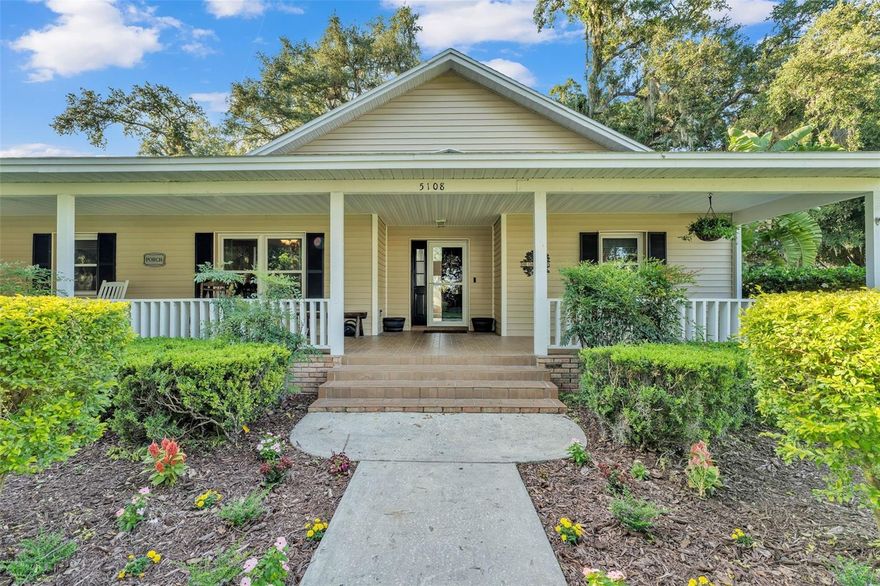 Welcome to this charming 3-bedroom, 2-bath home situated on a spacious 0.72-acre lot with no HOA in the desirable Waterwood subdivision. A long, welcoming front porch invites you inside to a bright split floor plan featuring vaulted ceilings, an open living area with a fireplace, and a separate dining room. The kitchen provides ample cabinet storage along with a cozy breakfast nook.  Outdoor living shines with a large back patio, vinyl-fenced backyard, and a screened porch off the primary bedroom—perfect for morning coffee or unwinding in the evening. The home is connected to a separate well for irrigation, keeping lawn care easy and utility costs low. Bonus space alert! The property features a 2-car garage, with one side currently enclosed and under A/C, being used as a flexible 4th bedroom. This area is not counted in the heated square footage but offers great versatility and can be converted back to a full 2-car garage if desired.  There's plenty of parking with an oversized circular driveway. Conveniently located near the Polk Parkway, Fort Fraser Trail, schools, shopping, and a nearby public boat ramp.