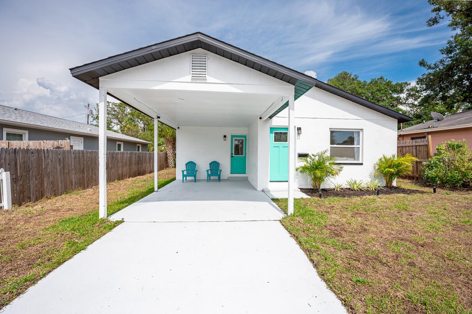 Welcome home to this completely renovated 3 bedroom 2 bath block construction property with a carport, ideally located in St. Pete! Upon entry you will notice the waterproof luxury vinyl flooring installed throughout the home, giving it a continuous feel. Your new kitchen boasts solid wood cabinetry with granite countertops, a subway backsplash, and stainless steel appliances. All plumbing and electrical fixtures throughout have been upgraded in 2021, along with a new water heater in 2021. New Vanities wit Granite Countertops & vessel sinks were updated in 2021. Other major components that have been recently upgraded include HVAC Condenser-2021,HVAC Air Handler-2023,HVAC Duct Work-2023, Washer/Dryer-2023 & Roof-2017. Both the interior/exterior of the home have been repainted to exude a modern feel, along with the driveway epoxy paint coating in 2025. The fenced in, sodded yard provides plenty of space for outdoor activities/leisure. This property experienced NO issues during the last major storms (X-Flood Zone, Flood Insurance not required). Location is key here being conveniently situated close to downtown Gulfport, St. Pete Beaches, I-275, Clam Bayou, Twin Brooks Golf Course, The Pinellas Trail, & Downtown St. Pete.