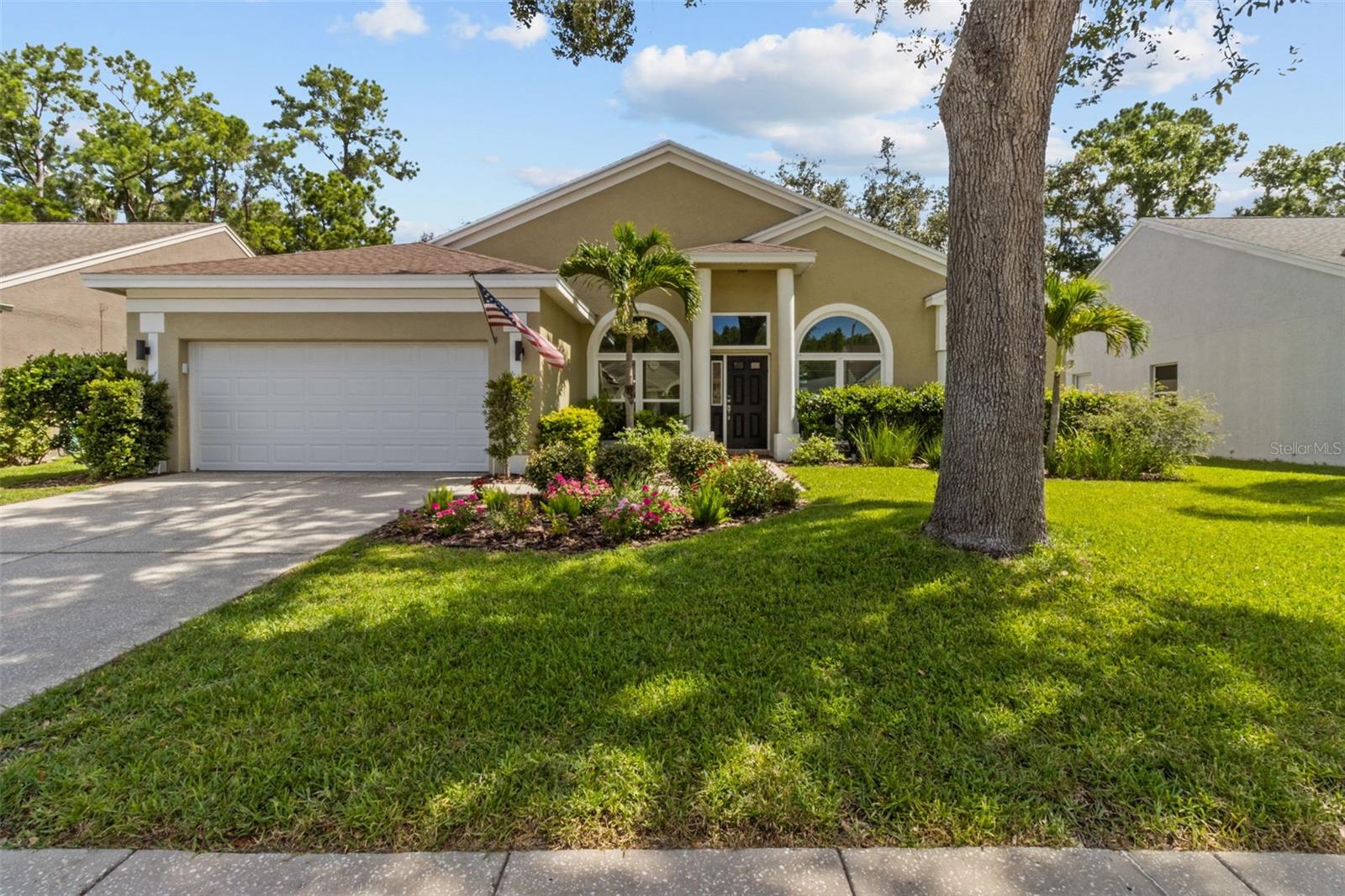 Ellinwood, one of the beautiful Lansbrook communities located near the Lansbrook Golf Course, Palm Harbor, FL. This well-maintained block and stucco pool home has been stylishly updated. Volume ceilings and large windows throughout, create a cheerful inviting home. Living and dining rooms are spacious and bright. The family room, kitchen, and breakfast areas overlook the private pool and lanai area. This arrangement is perfect for entertaining. The primary bedroom offers sliders opening to the pool area, lots of windows, large upgraded private bath including a garden tub, walk-in shower, 2 separate vanities with quartz tops, and a HUGE walk-in closet with shelving. The remaining bedrooms and bath are located off the family room, which can provide a separate quiet area for office space as well. Roof replaced in 2021.
Updates are: New luxury vinyl 2025. Impact rated garage door 2023. Impact windows and slider door 2022, 2023. Updated kitchen cabinets, farm style sink and quartz countertops. Kitchen appliances remain with home. Large food pantry. Kitchen is open to the family room, with views of pool area and private backyard. Laundry room (washer and dryer remain) conveniently located adjacent to the kitchen and 2 car garage. Neglected to mention that the pool area has access to the guest bath, which could minimize wet messy floors while enjoying the heated saltwater pool.
Short drive to: Tampa International Airport or Clearwater-St Pete Airport, Shopping and restaurants, Clearwater Beach or Honeymoon Island Beach and hospitals. You are close to many wonderful public parks and miles of trails for running, walking, biking. In the neighborhood, you will find a waterfront park with boat access to Lake Tarpon, pickleball court, basketball and soccer field. Something for everyone to enjoy.