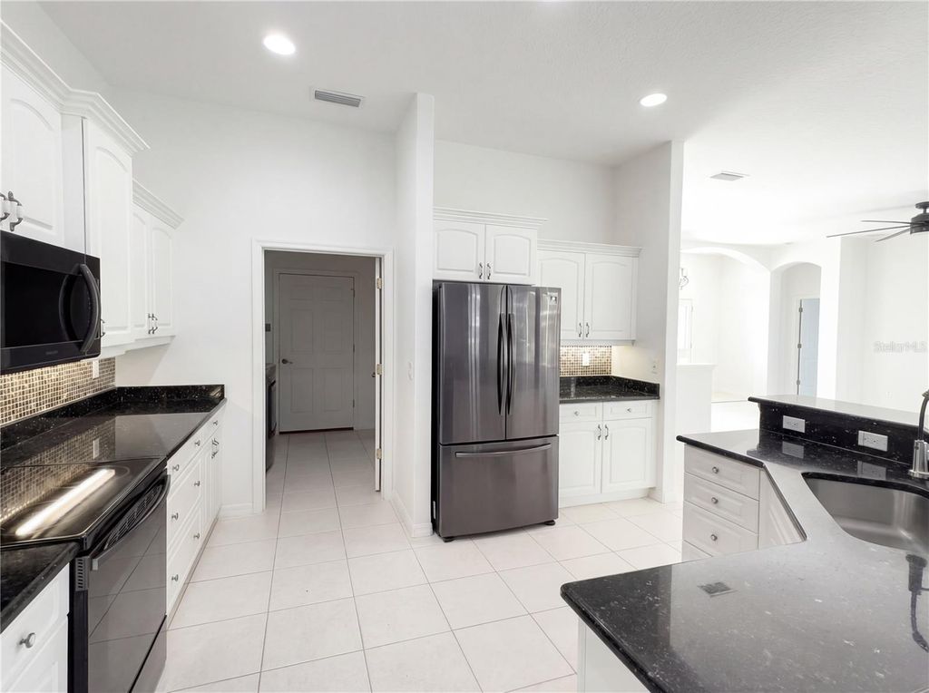 Photo of 65 Ballenger Lane, Palm Coast, FL 32137 (MLS # O6389193)