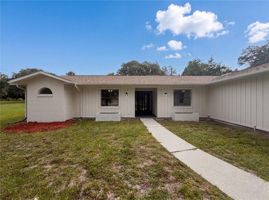 Photo of 9819 E Lake Tahoe Drive, Inverness, FL 34450 (MLS # O6415707)
