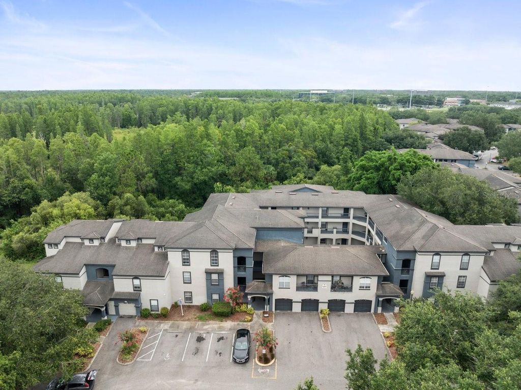 Photo of 12912 Arbor Isle Drive #202, Temple Terrace, FL 33637 (MLS # TB8399662)