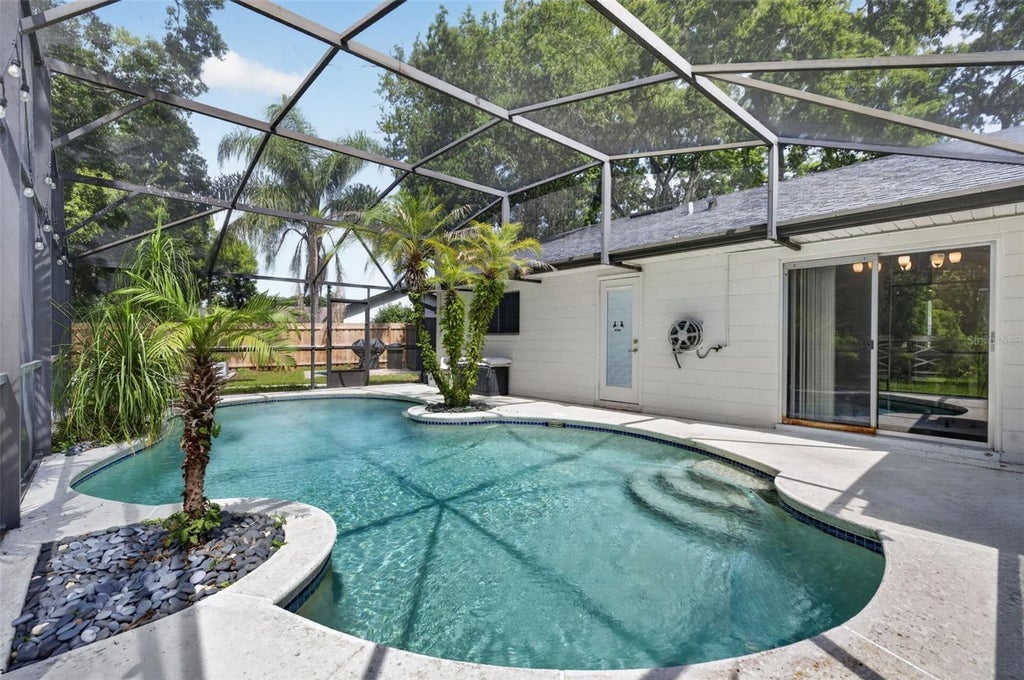 Photo of 7767 Compass Drive, Orlando, FL 32810 (MLS # O6439902)
